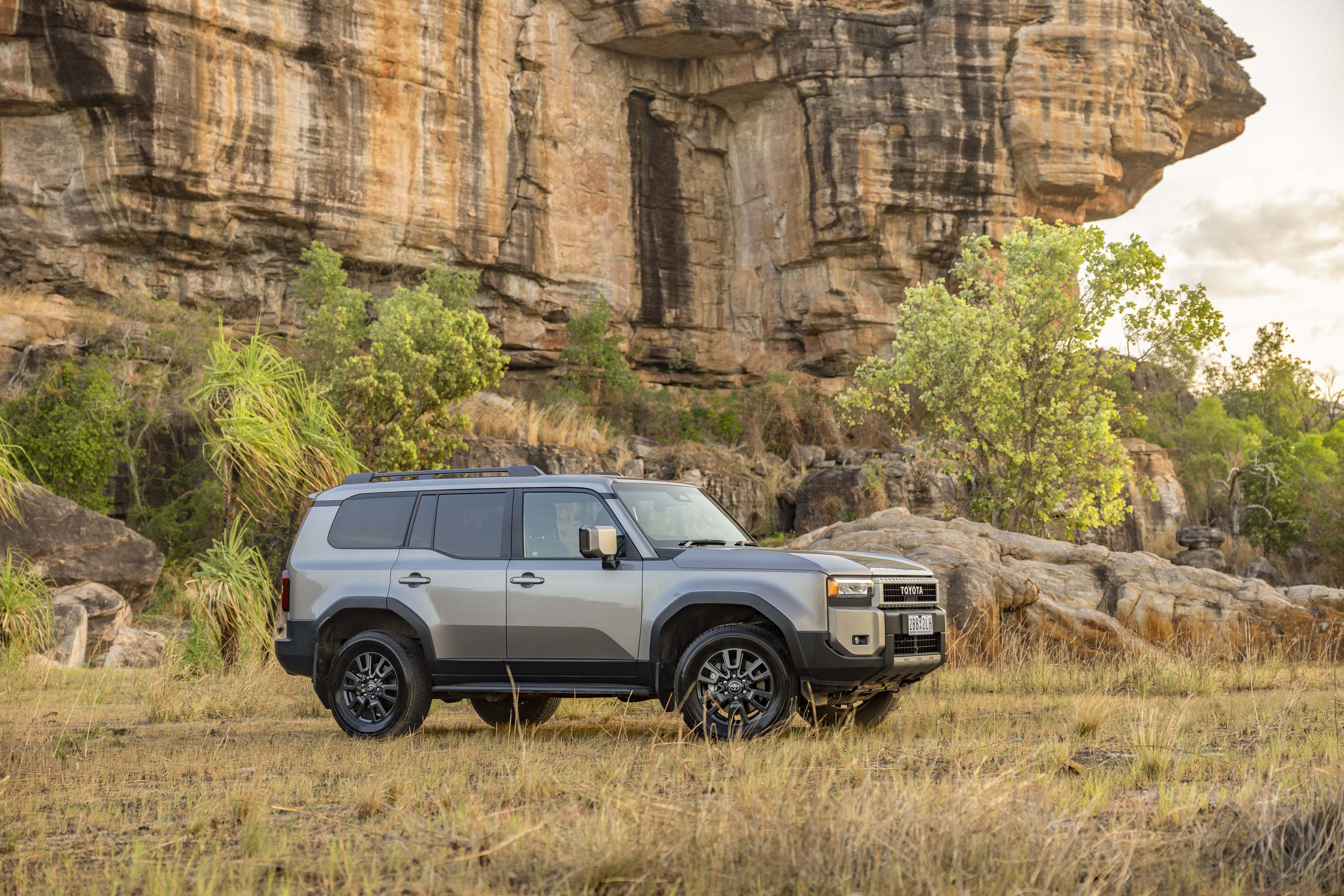 A grey Toyota Prado in a bushland setting