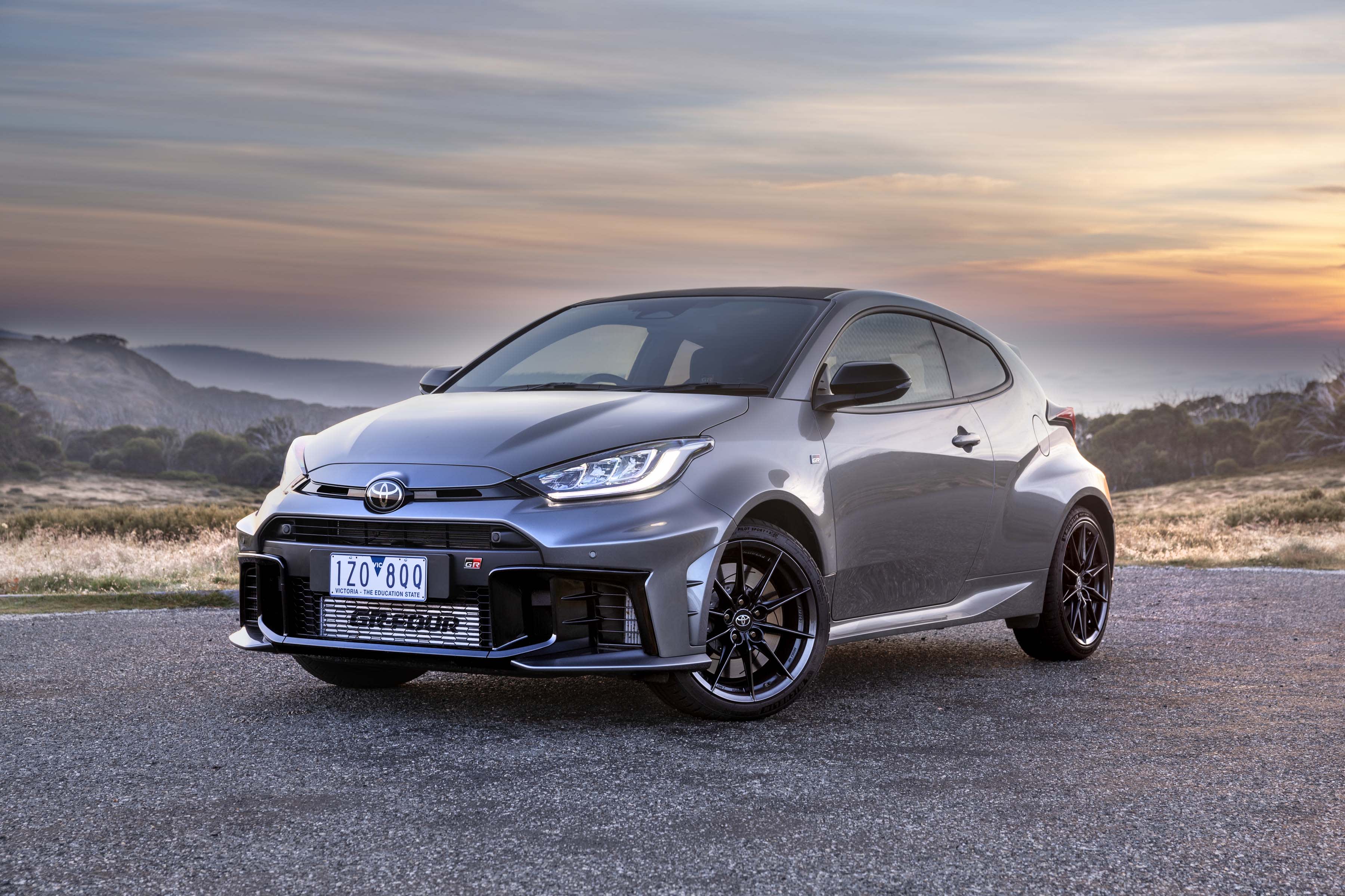 A grey Toyota GR Yaris in a mountain setting