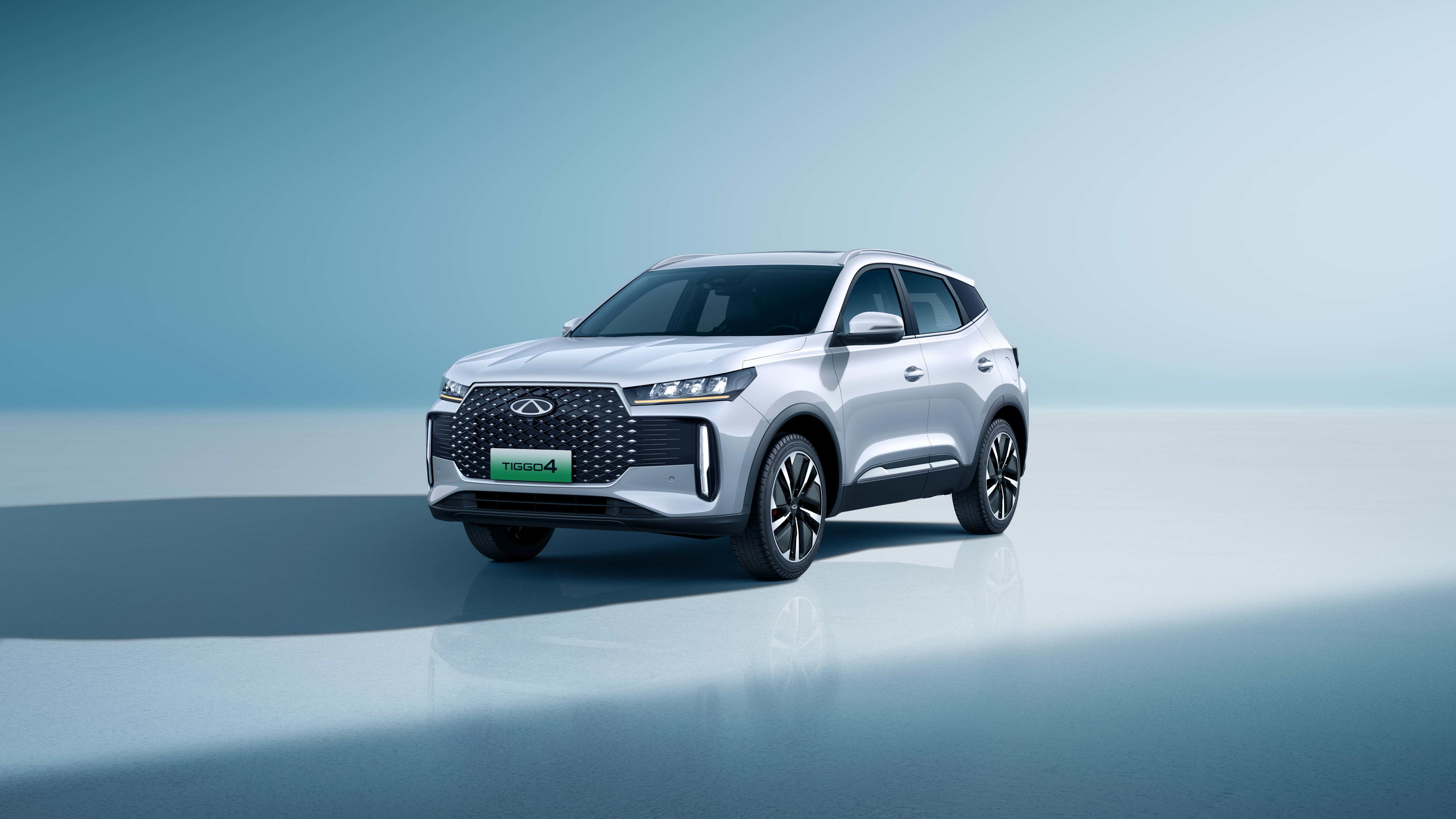 A white  Chery_Tiggo_4 in a studio setting