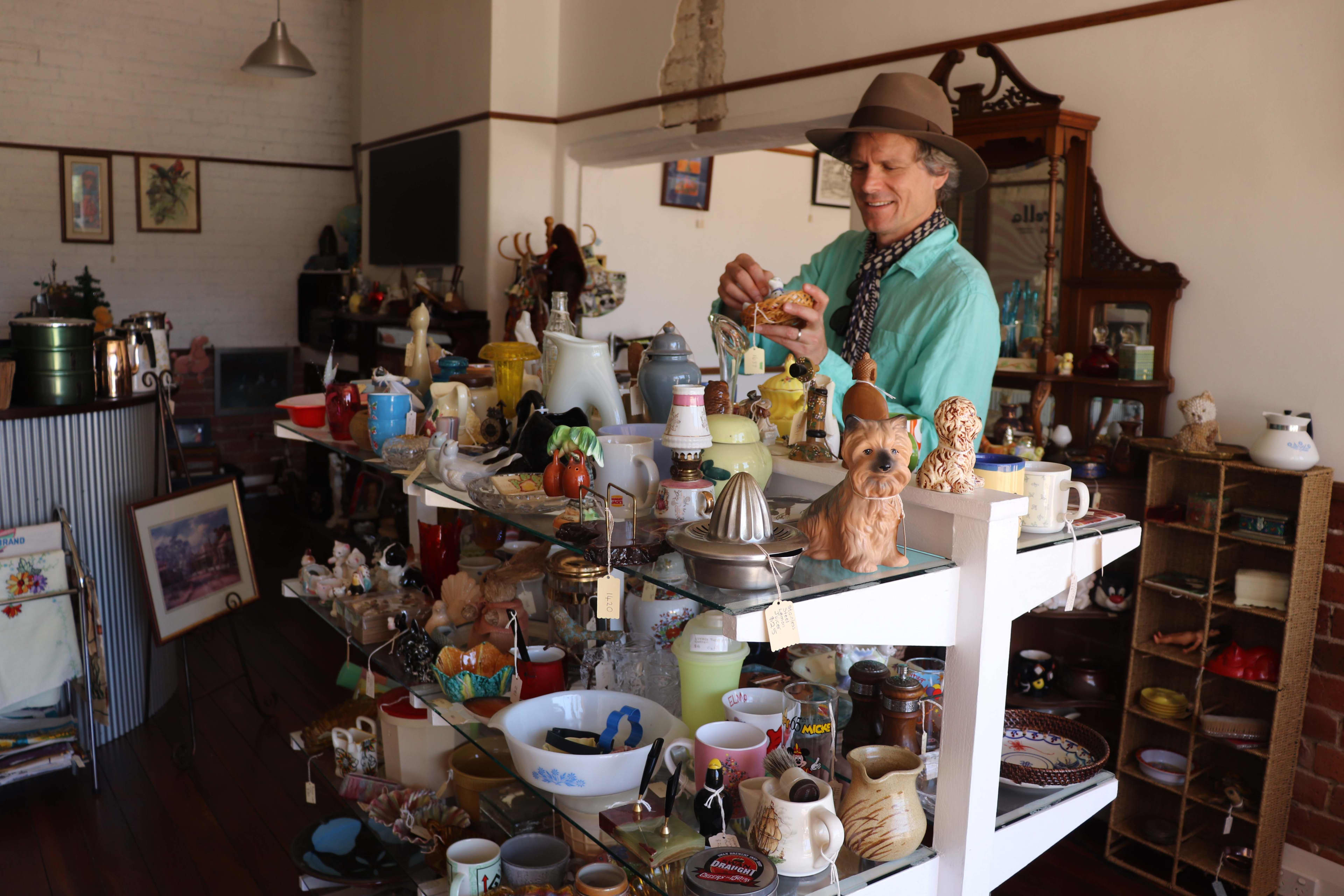 A person browsing inside Bella Corella op shop