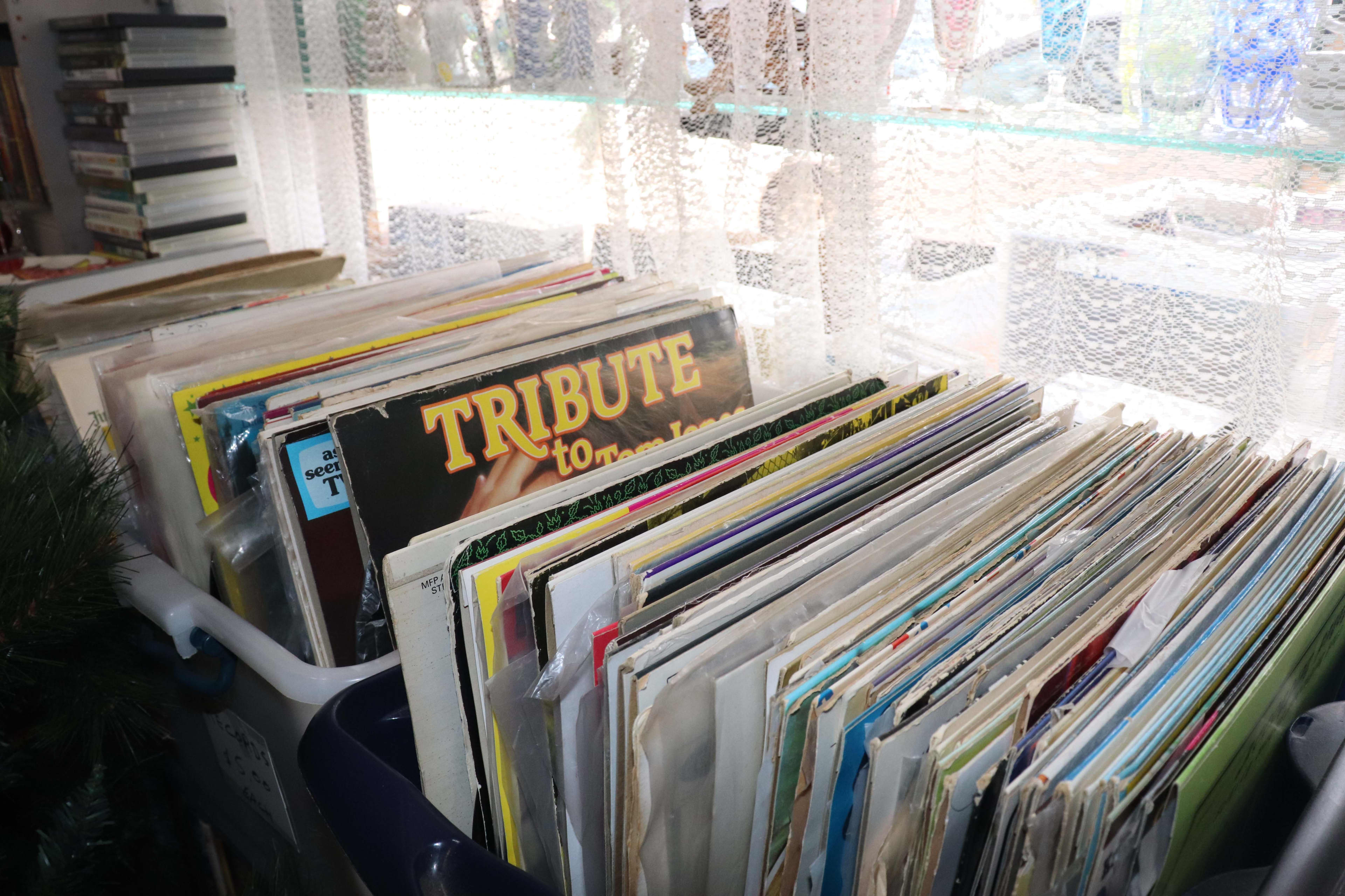A stack of records on a shelf