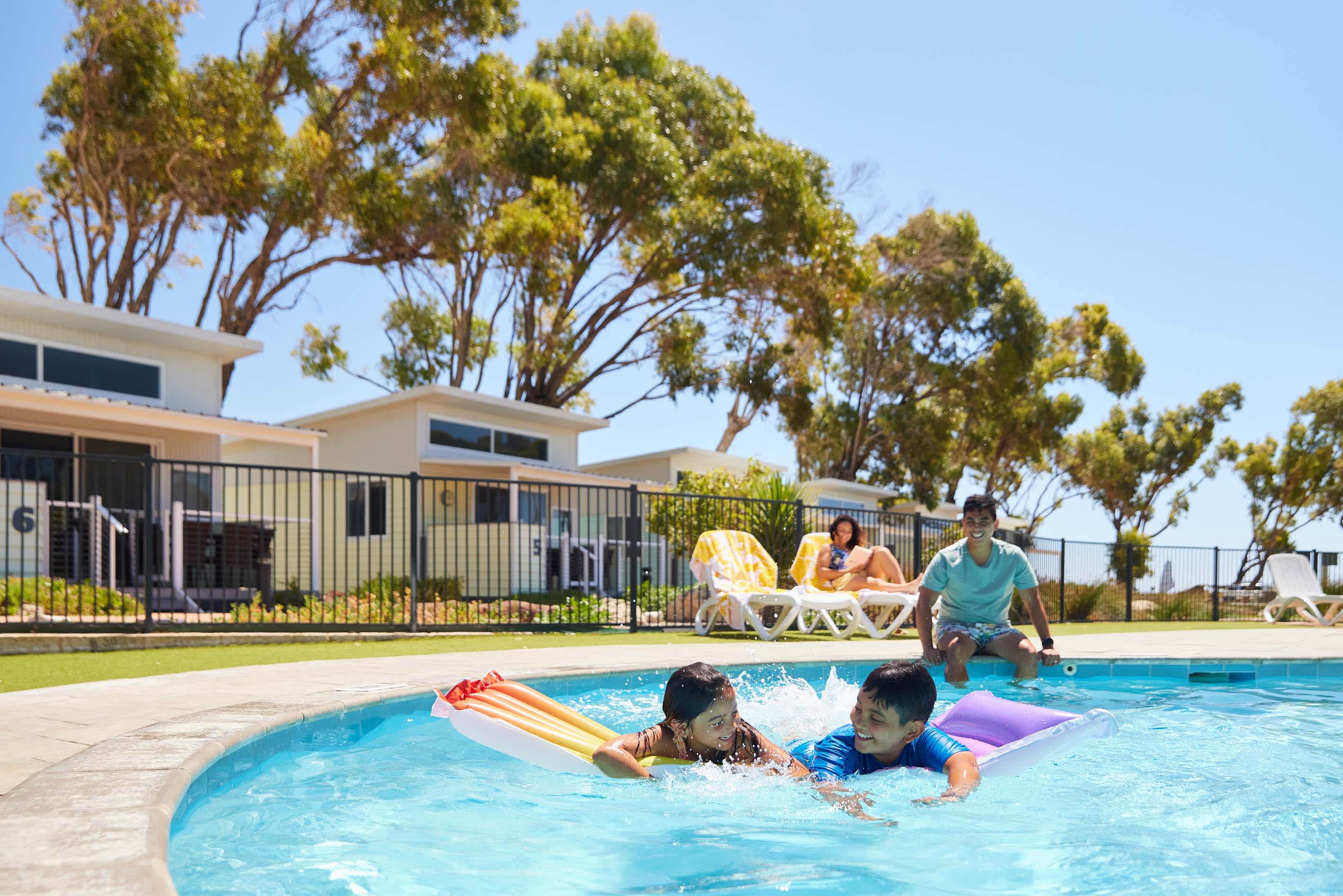 Children swimming in a resort pool