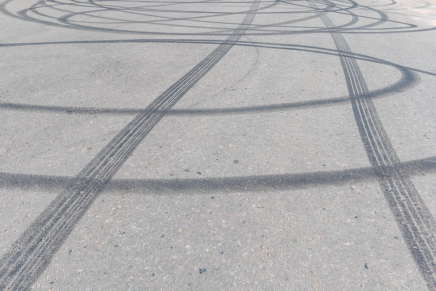 A road showing multiple tyre skid marks