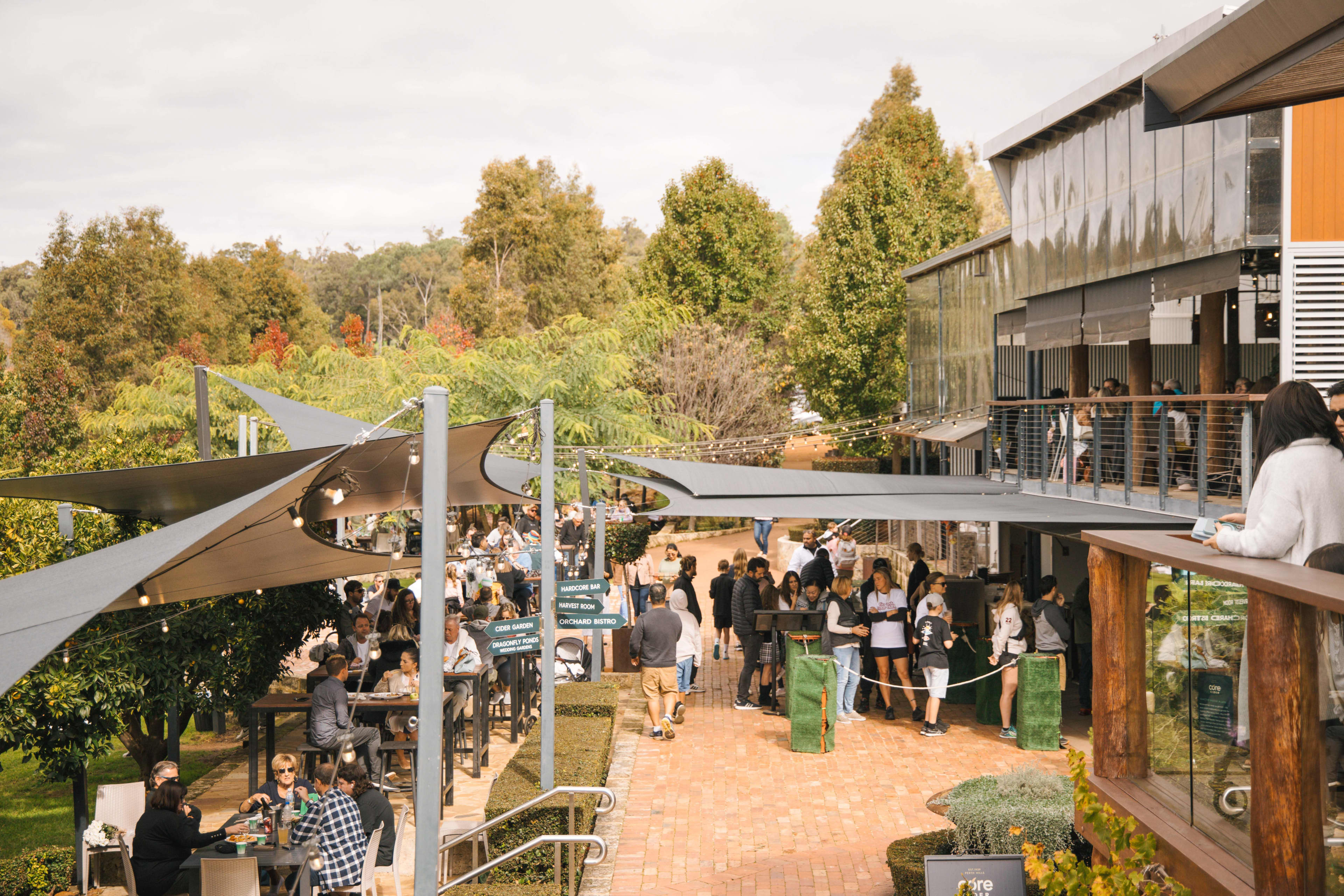 People dining outdoors at Core Cidery