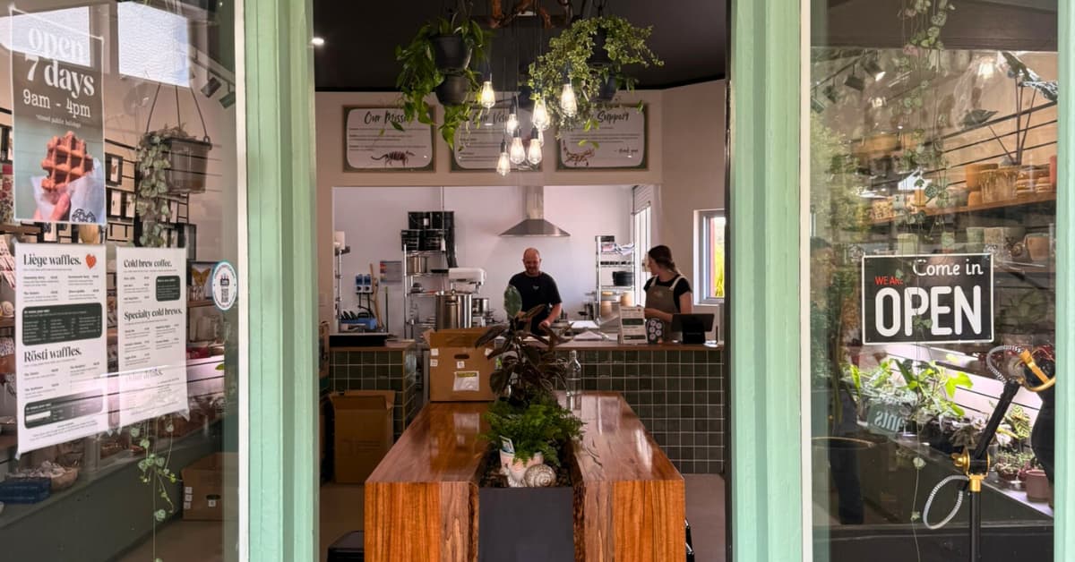 Green doorway entrance to plant cafe.