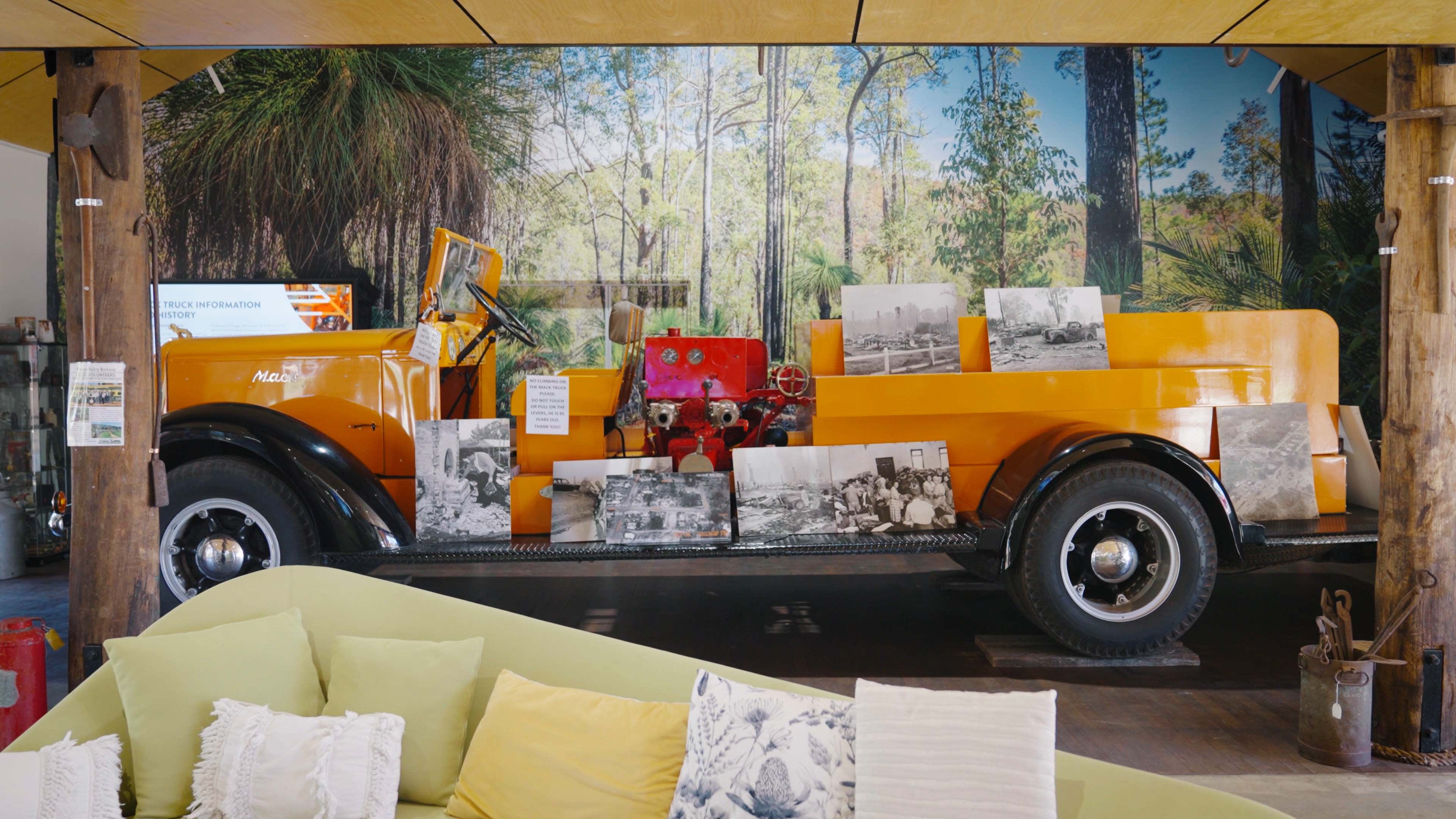 An old orange fire truck inside the Dwellingup Visitor Centre