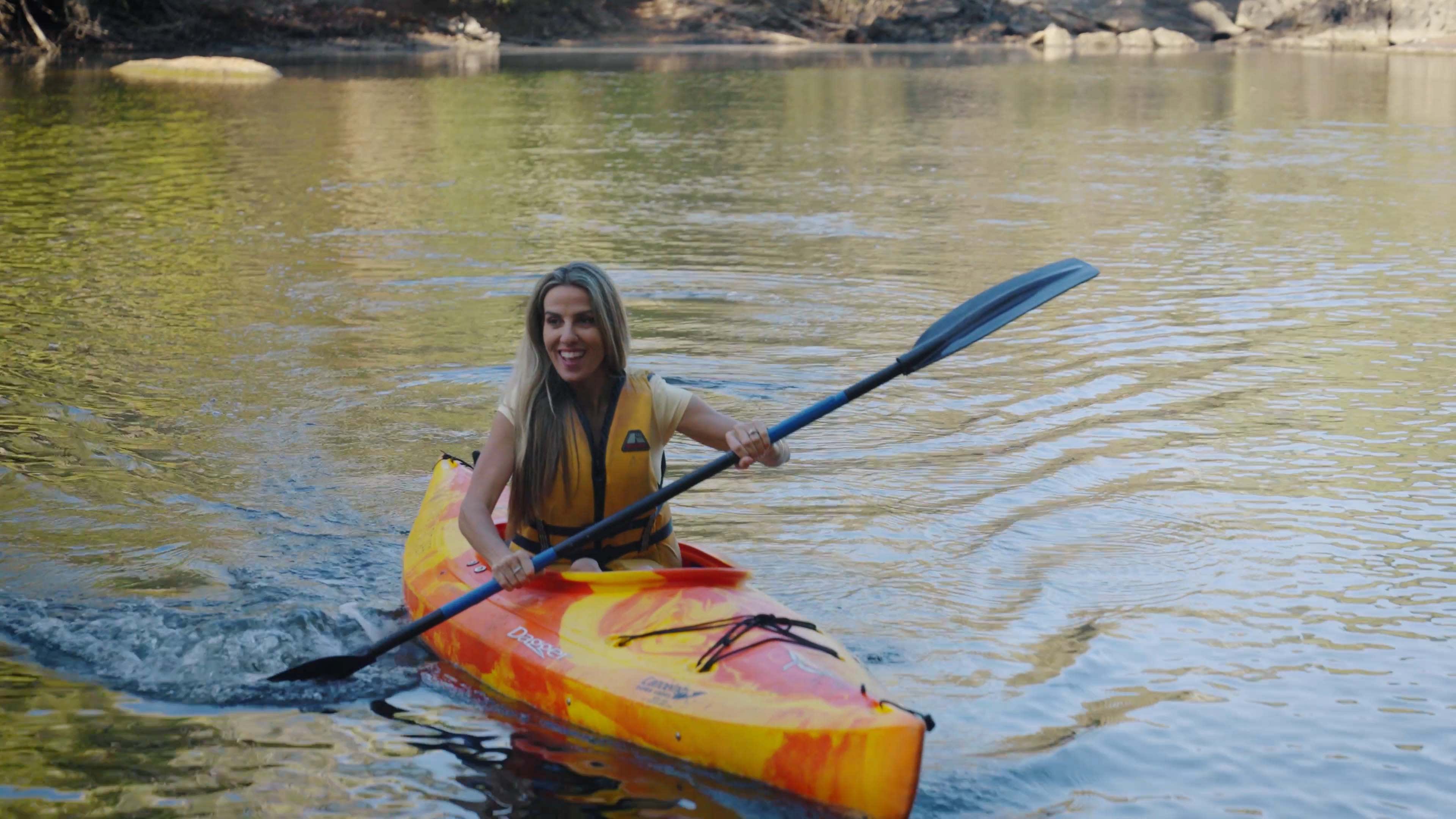 A person kayaking on the river in Dwellingup