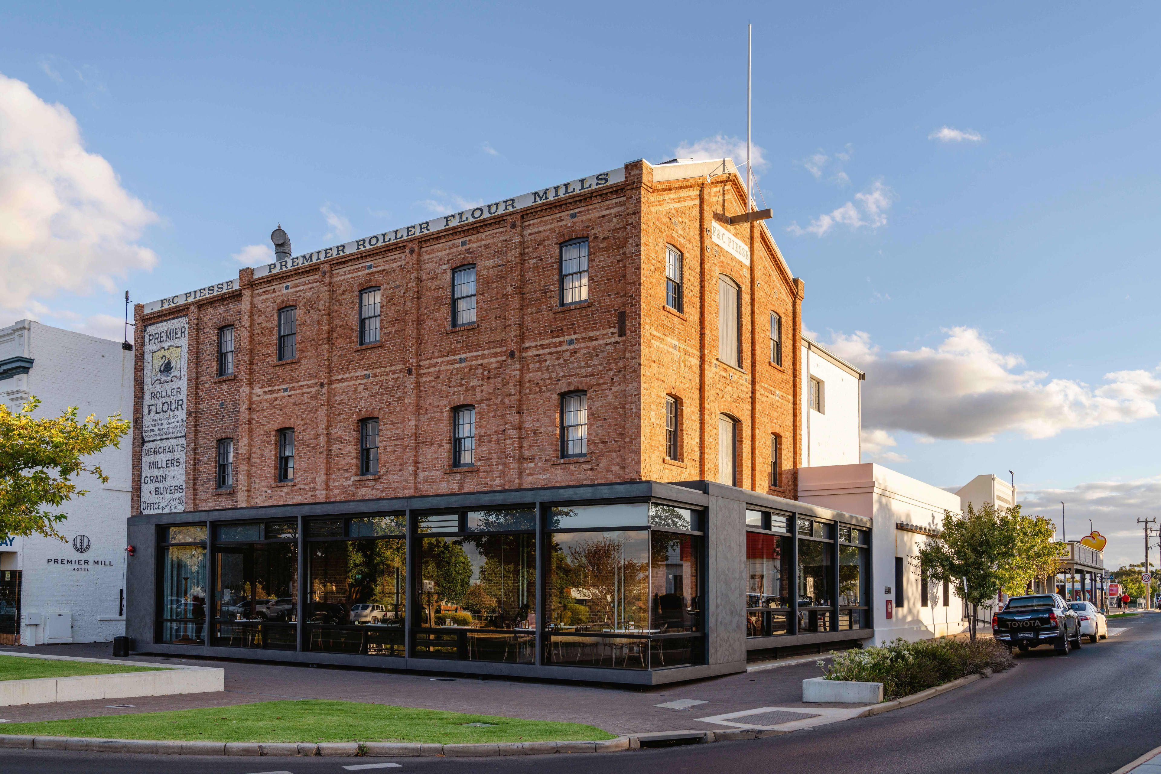 View of old flour mill in Katanning from outside with original brickwork and cafe on ground level.