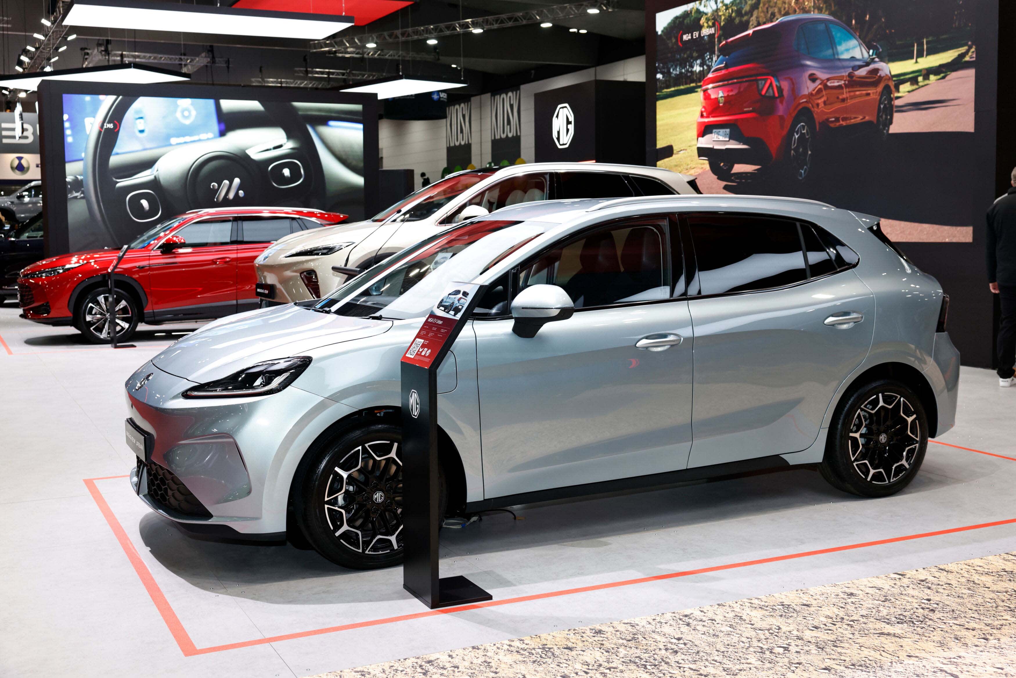 A silver MG4_Urban_EV at a car show