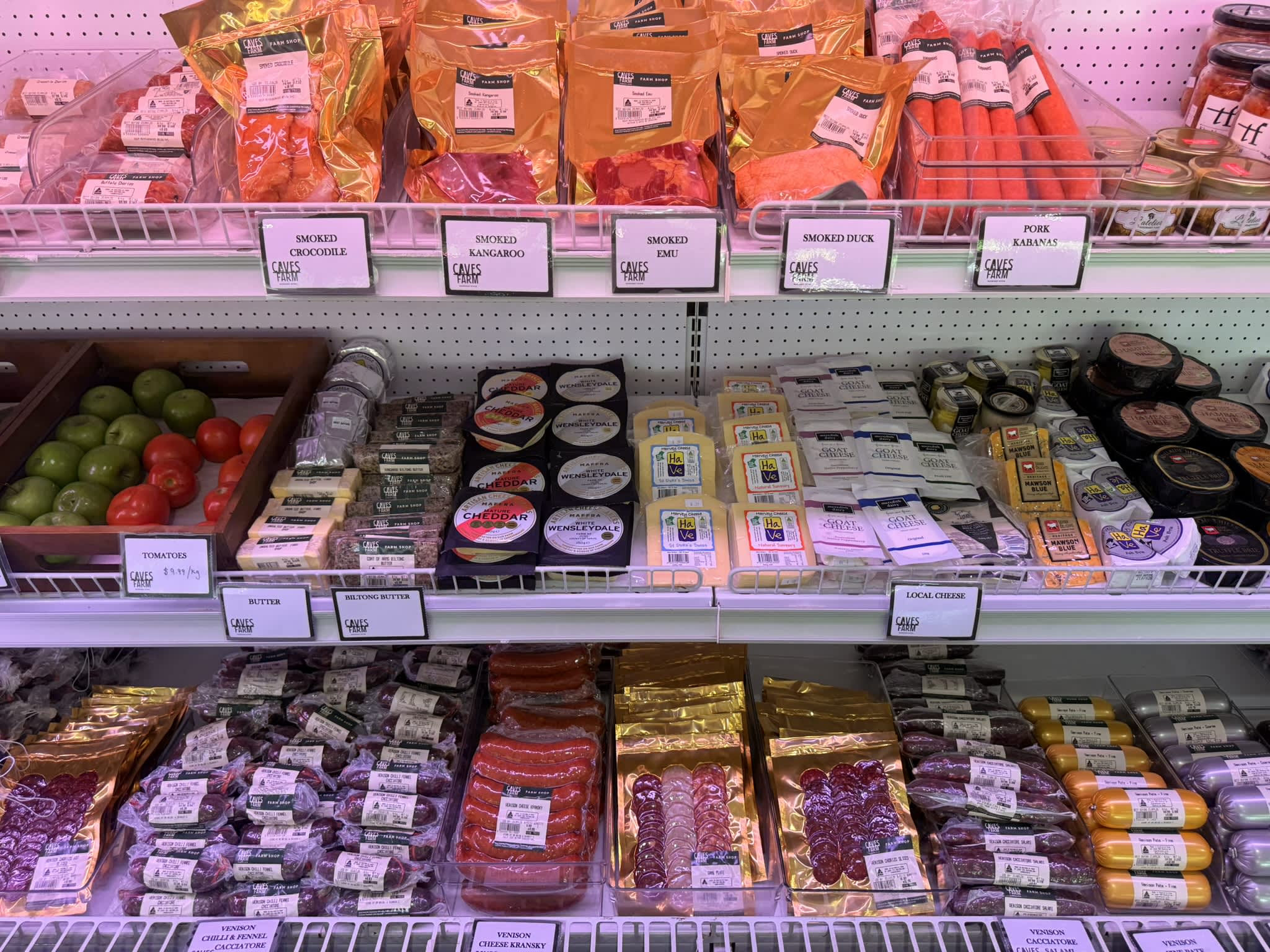 Fridge filled with gourmet meats and cheeses