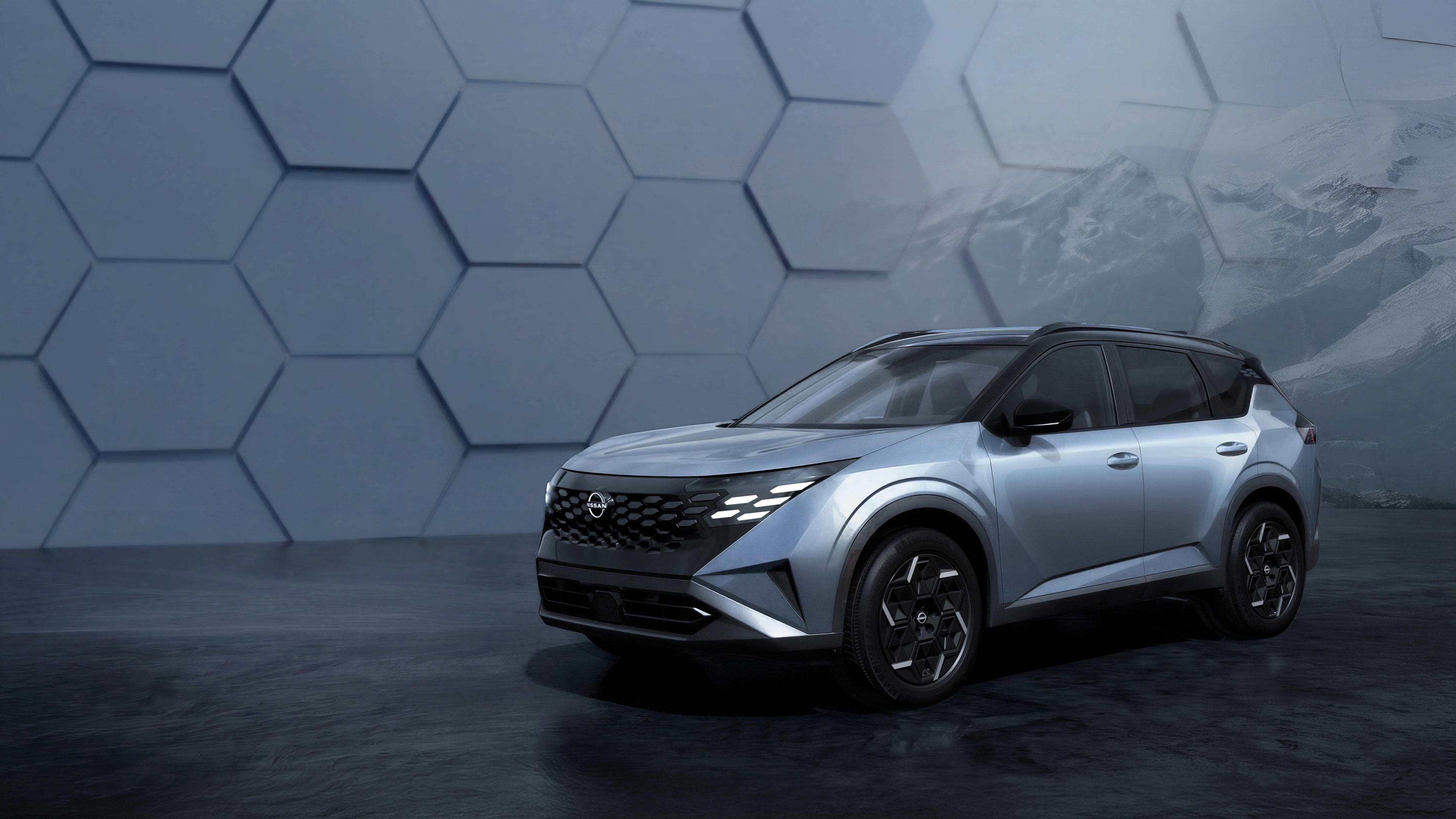 A silver Nissan X-Trail e-power in a studio setting
