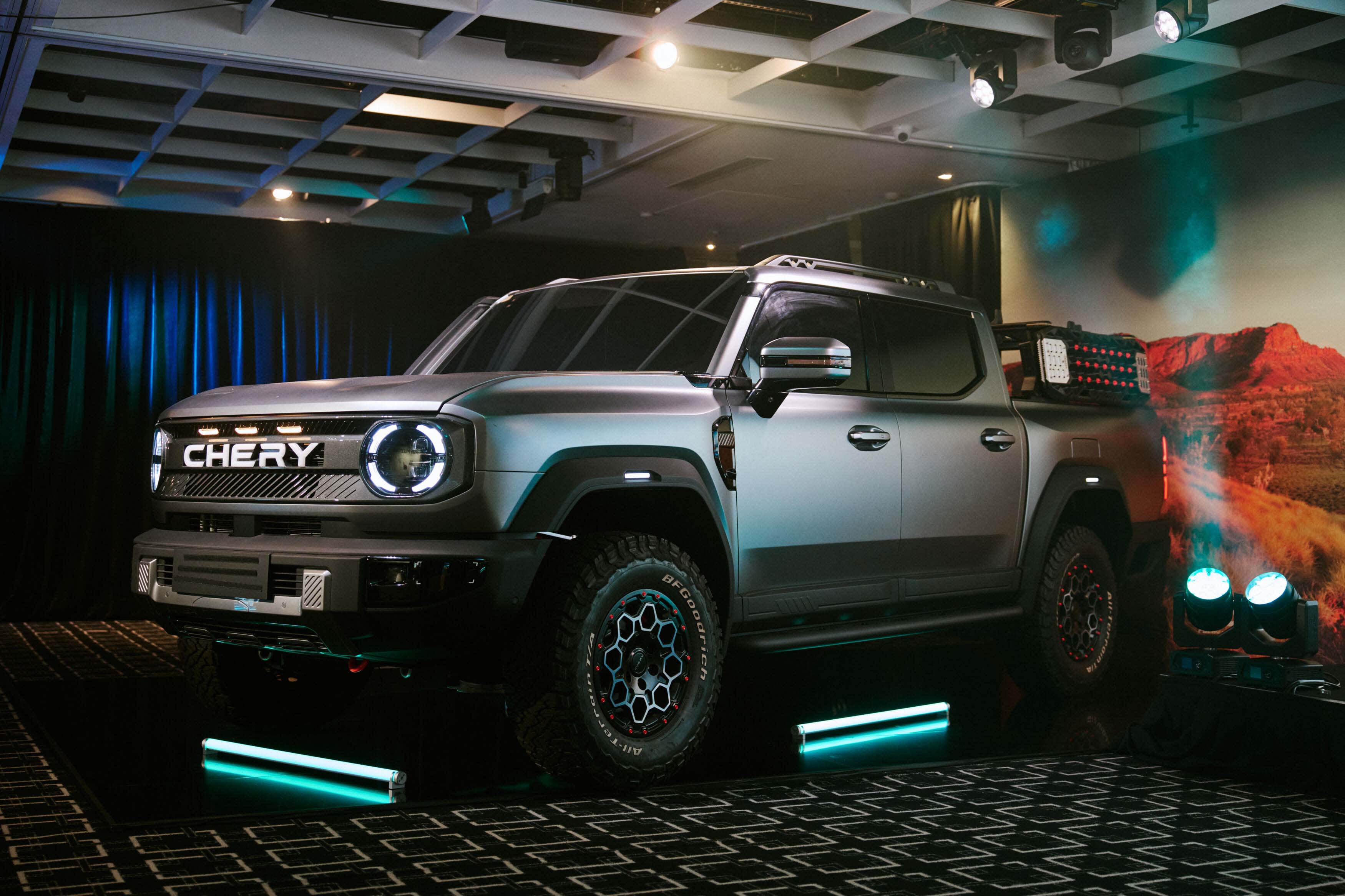 A silver Chery dual cab ute on display at a motor show