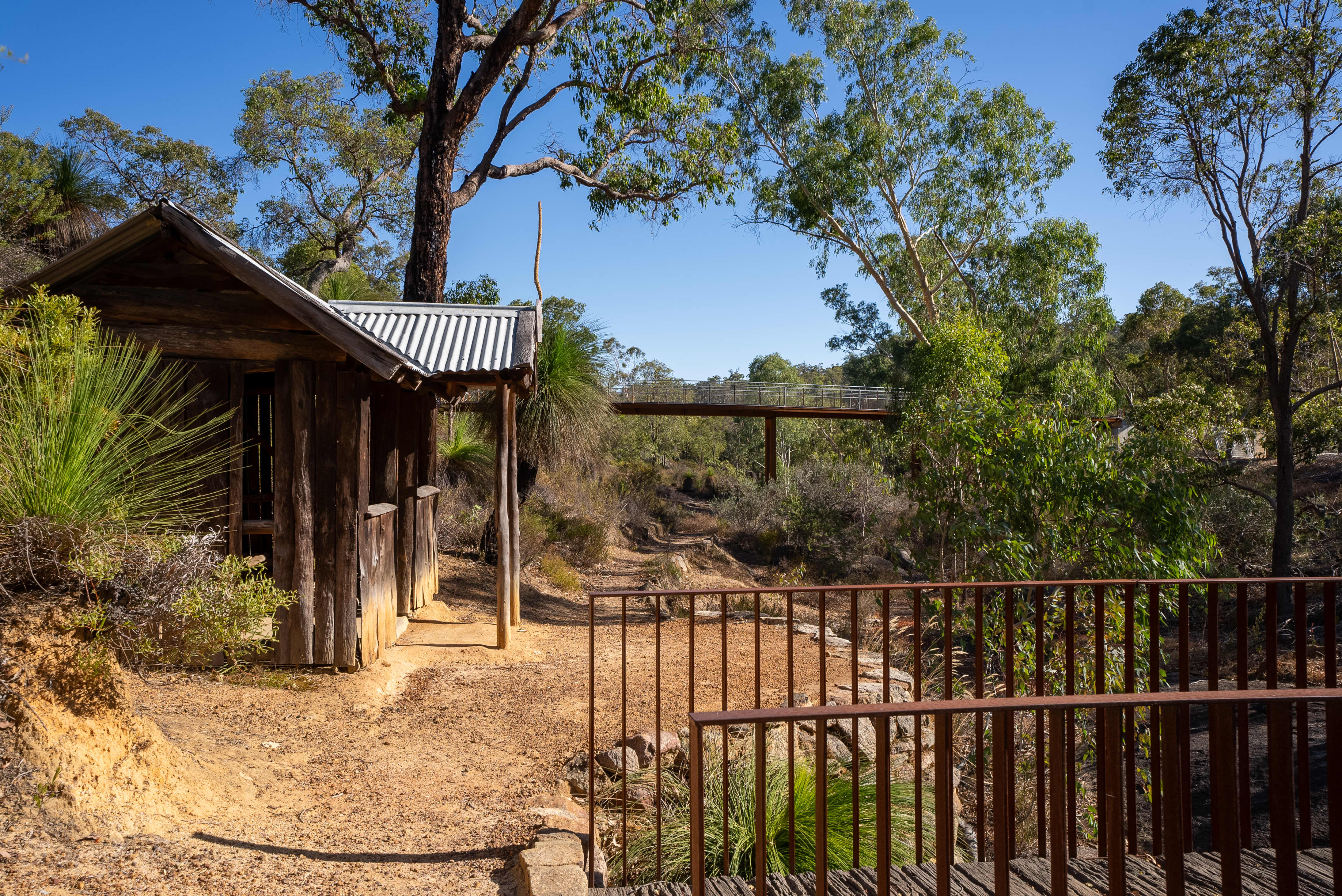 A hut in forest with two bridges.