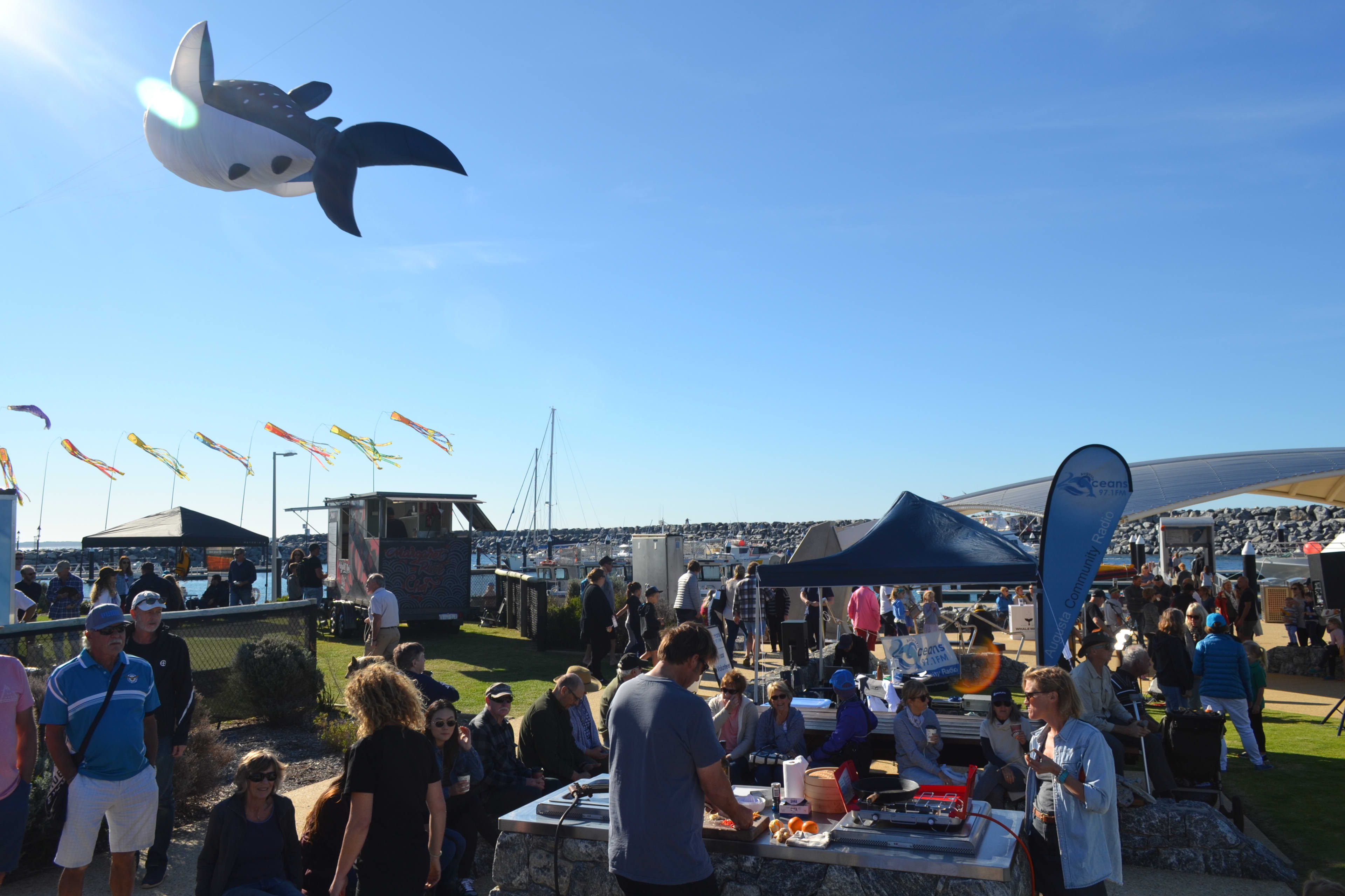 Crowd at markets on waterfront for whale festival