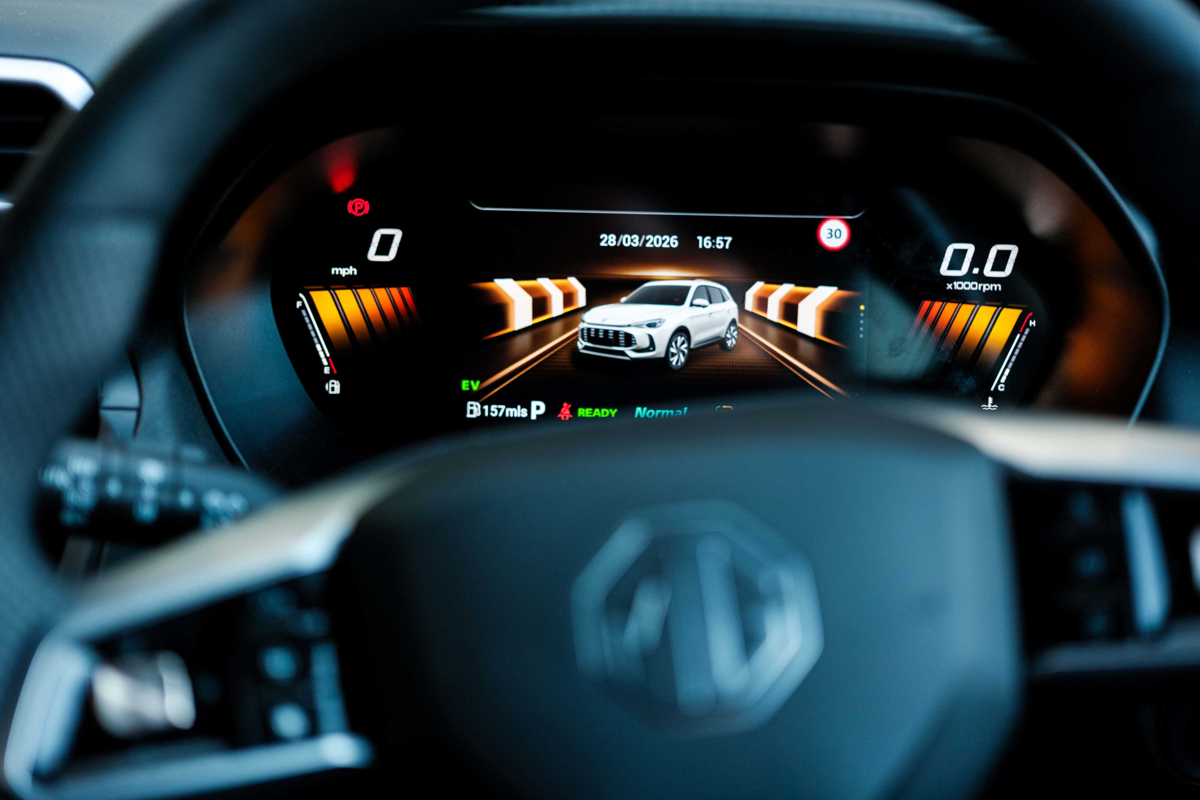 An electronic display in a car showing driver assist features