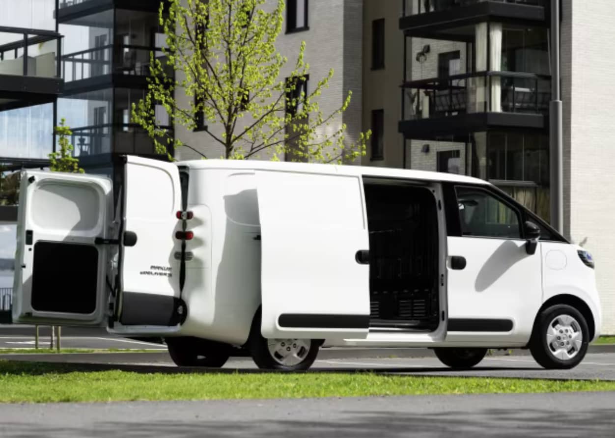 A white LDV eDeliver 5 EV van with doors open parked near high rise apartments