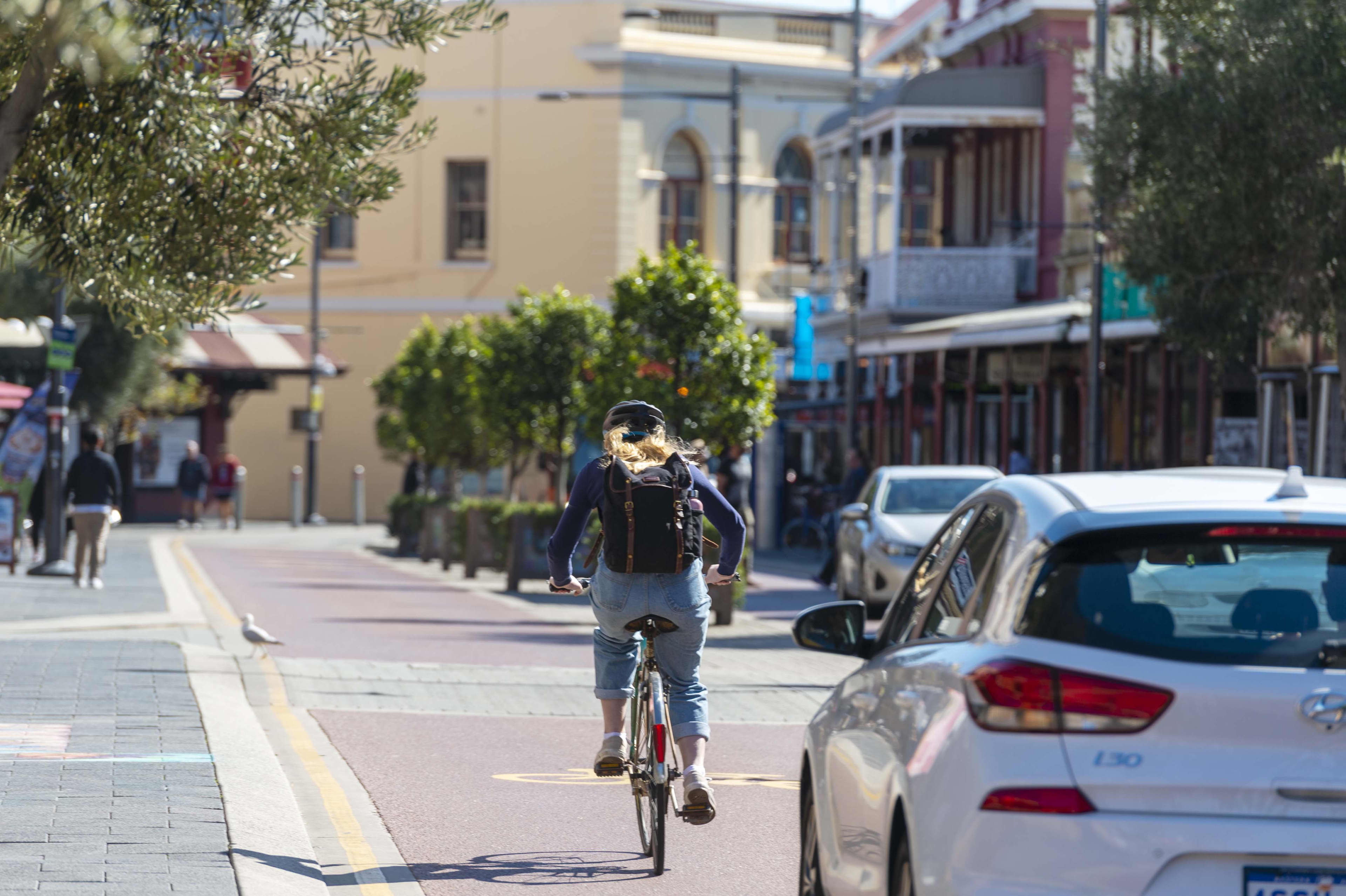 A cyclist on the street in Fremantle