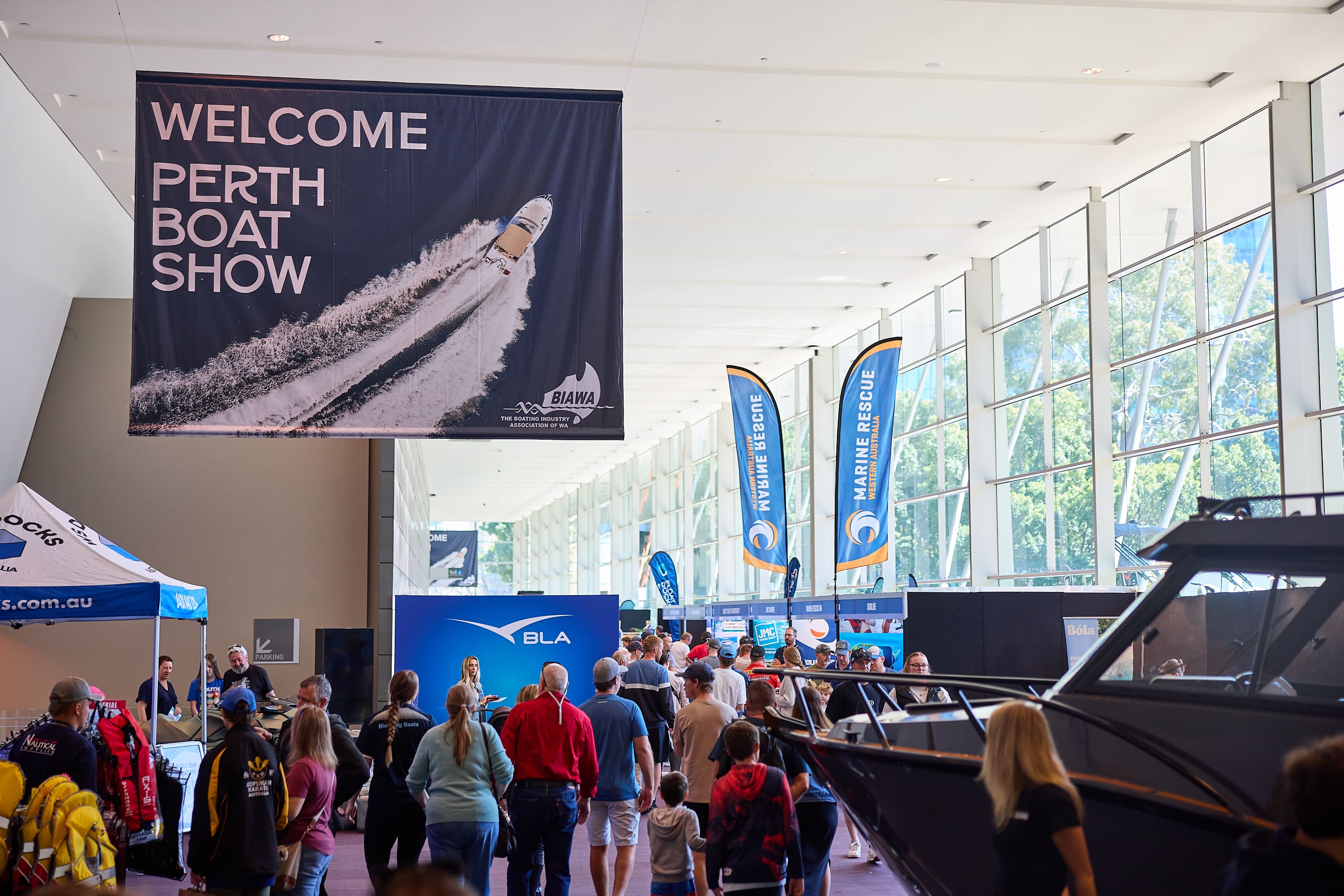 Perth Boat Show banner and people entering exhibition.