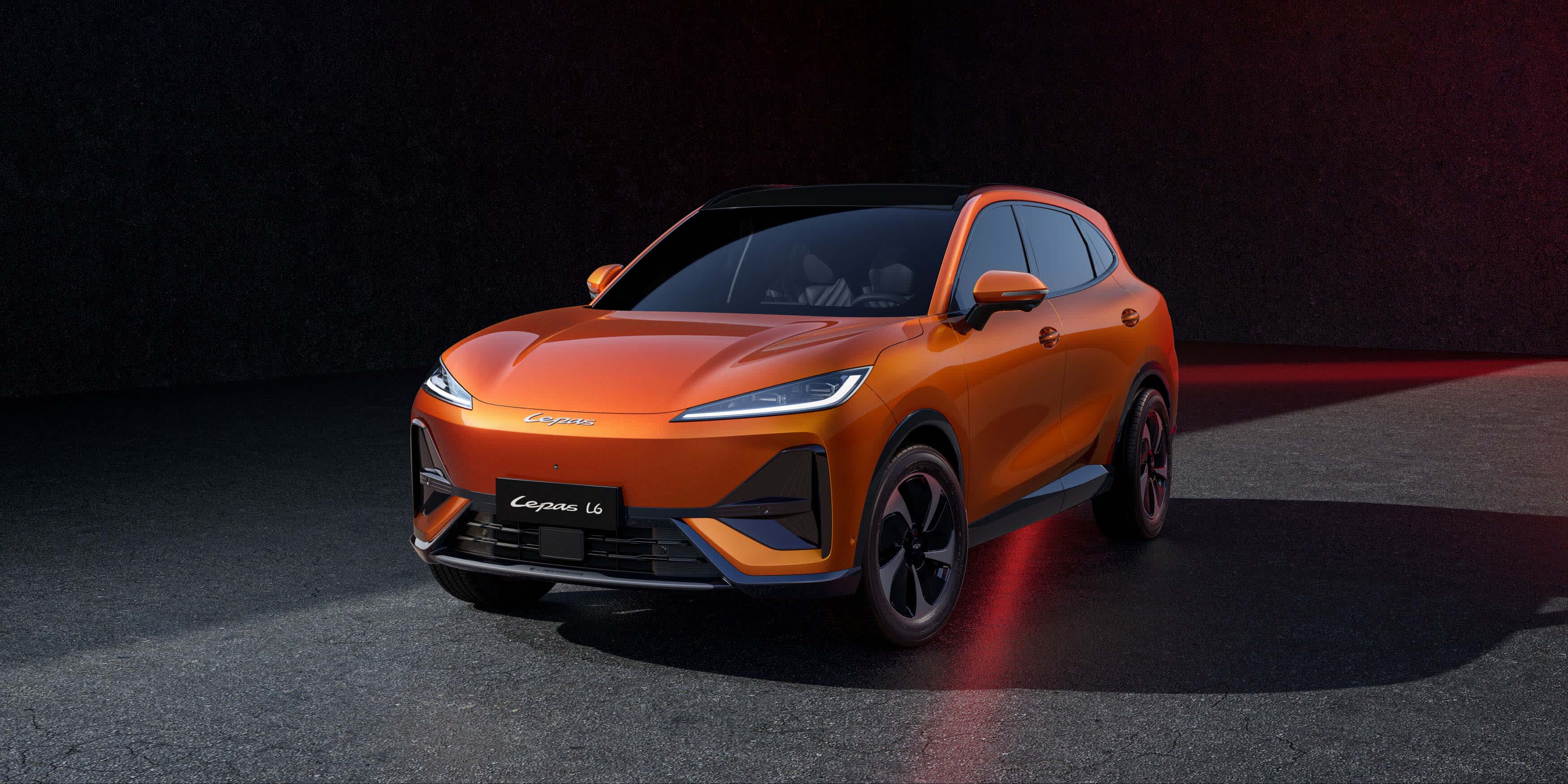 A bronze Lepas L6 EV parked in a   dark studio setting