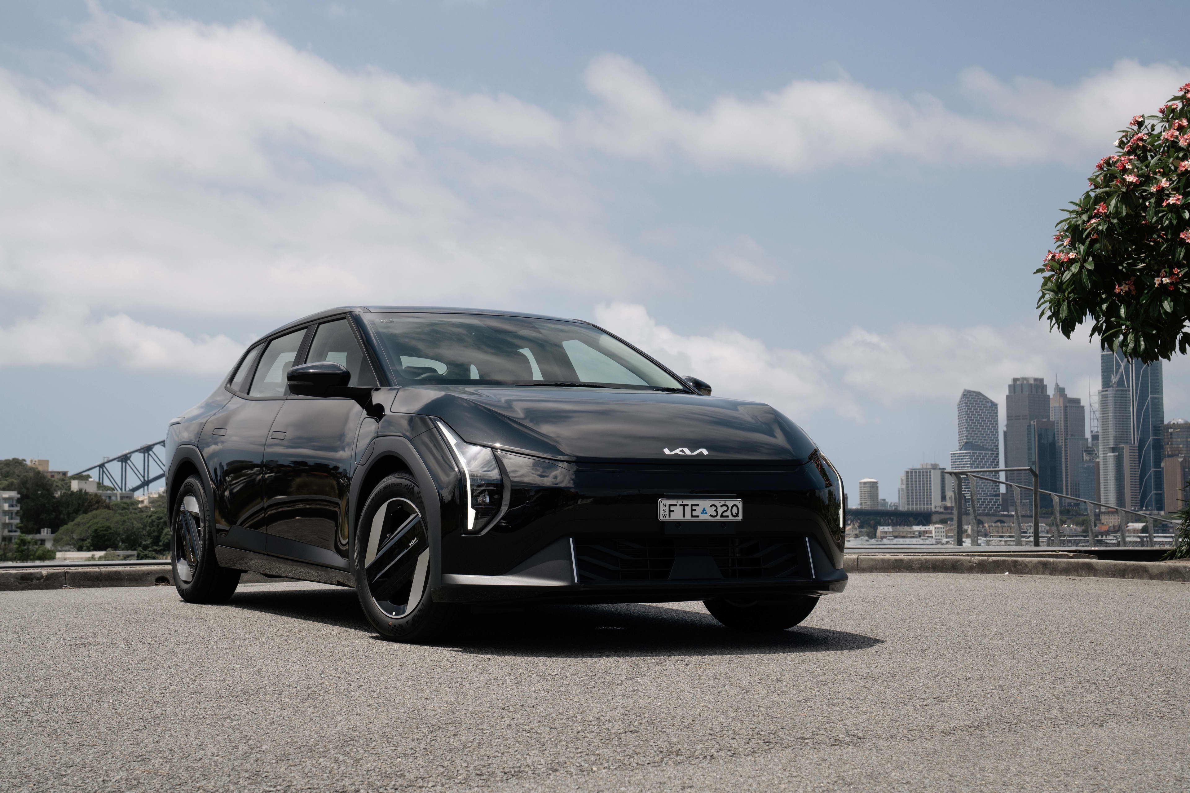 A black Kia EV4 Sedan Air parked on a tarmac