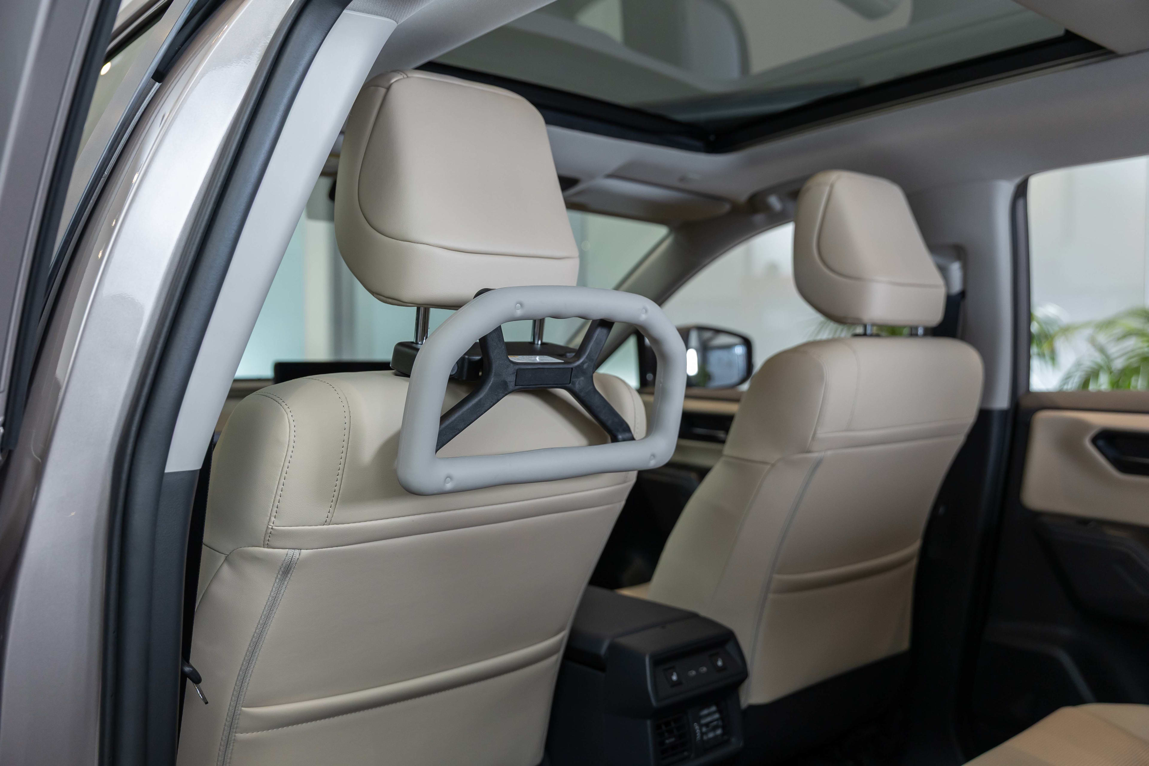 Back seat of a car with a mobility handle