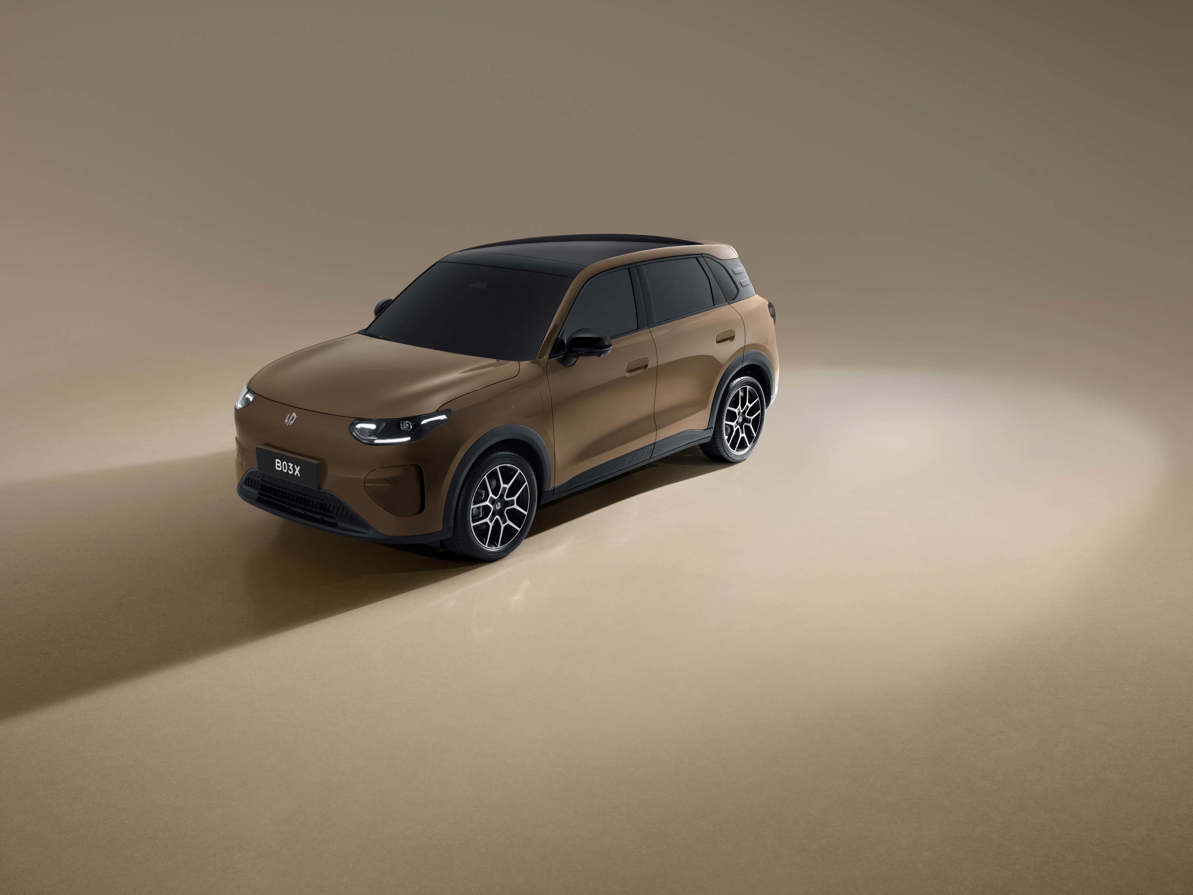 A brown Leapmotor EV against a beige studio background, with a spotlight that causes the car to cast a shadow.