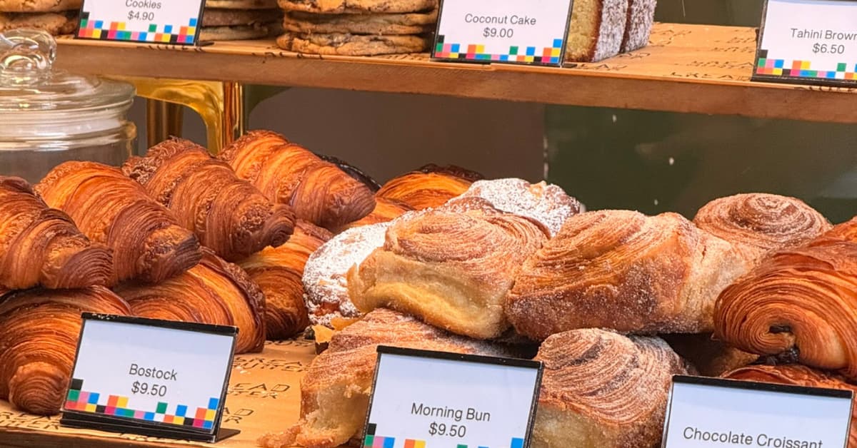 Selection of different croissants and pastries in a cabinet