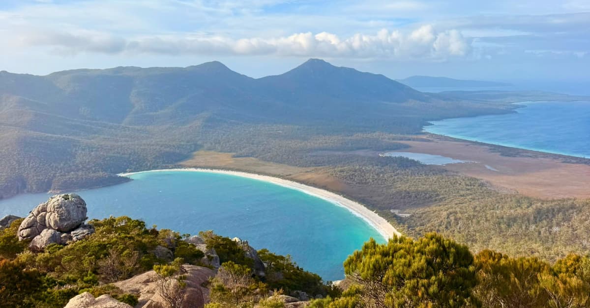 Views of turquoise bay from on top of nearby mountain