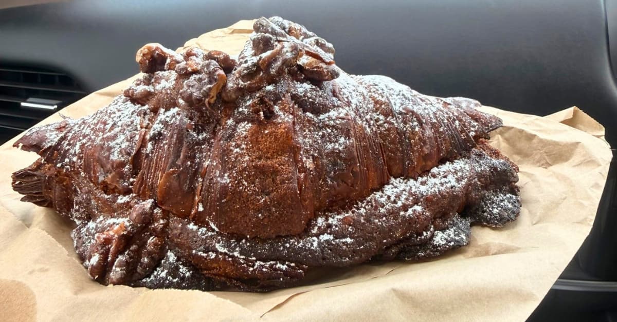 A walnut croissant on display while driving along roads by passenger