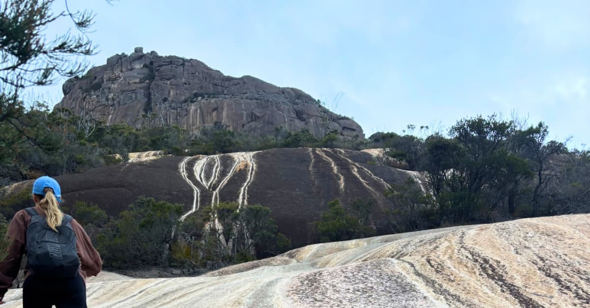 Steep slanted dark rocks on a hike
