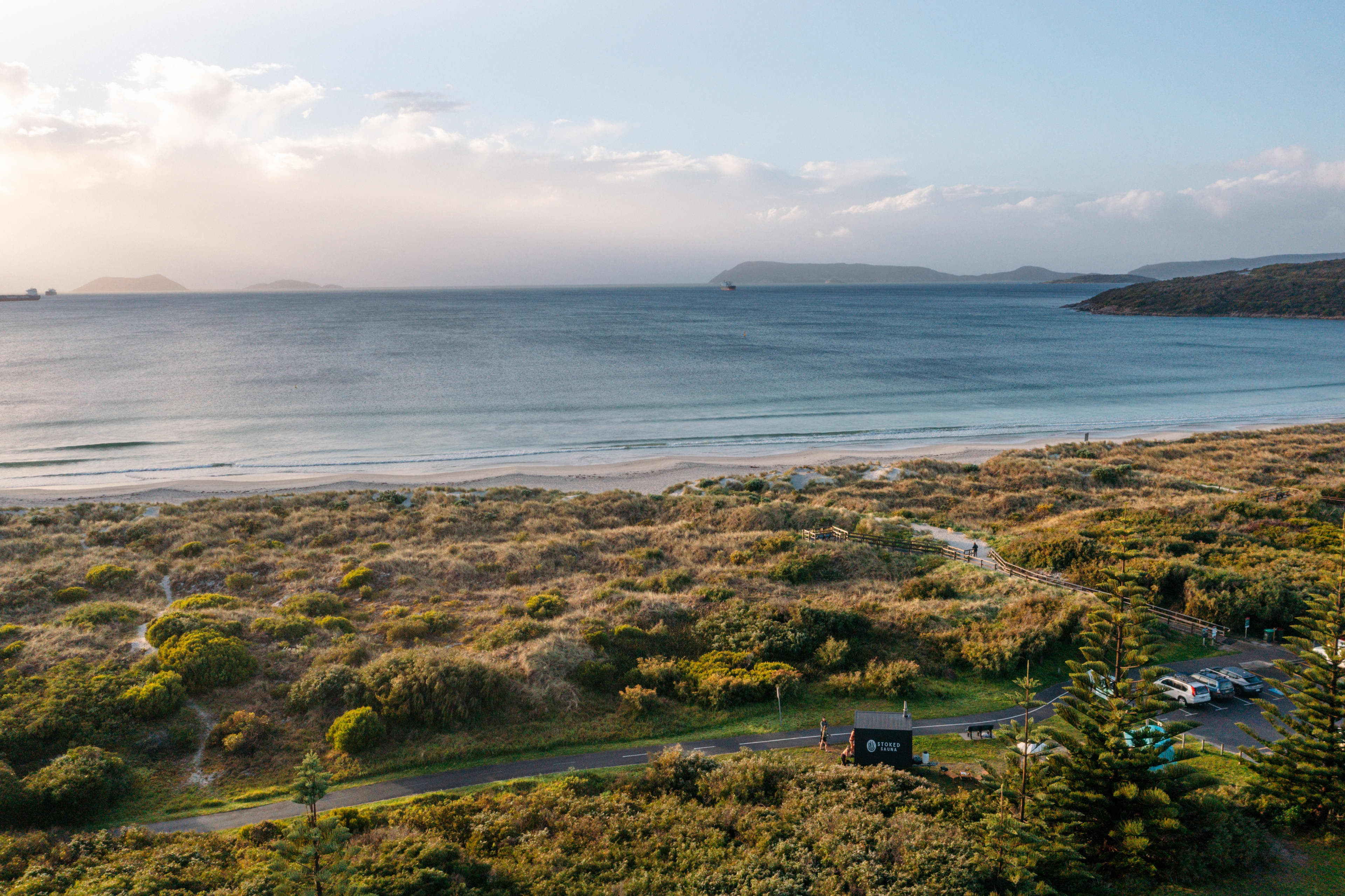 Mobile timber sauna tucked into bushland near beach