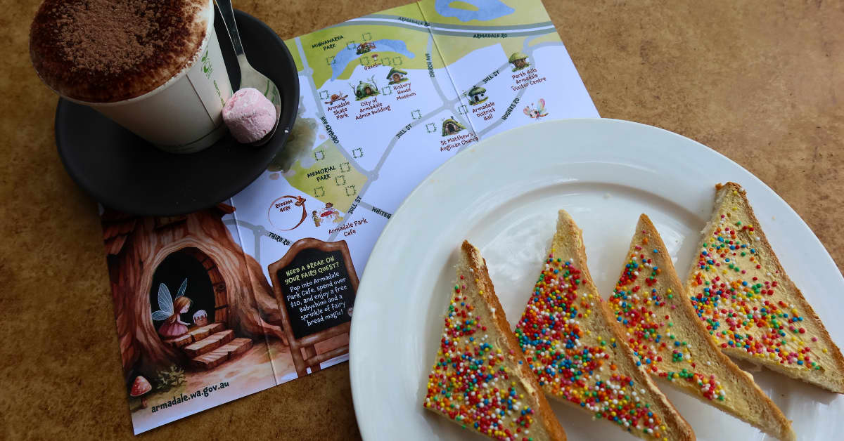 Capuccino in mug with fairy quest map and fairy bread slices