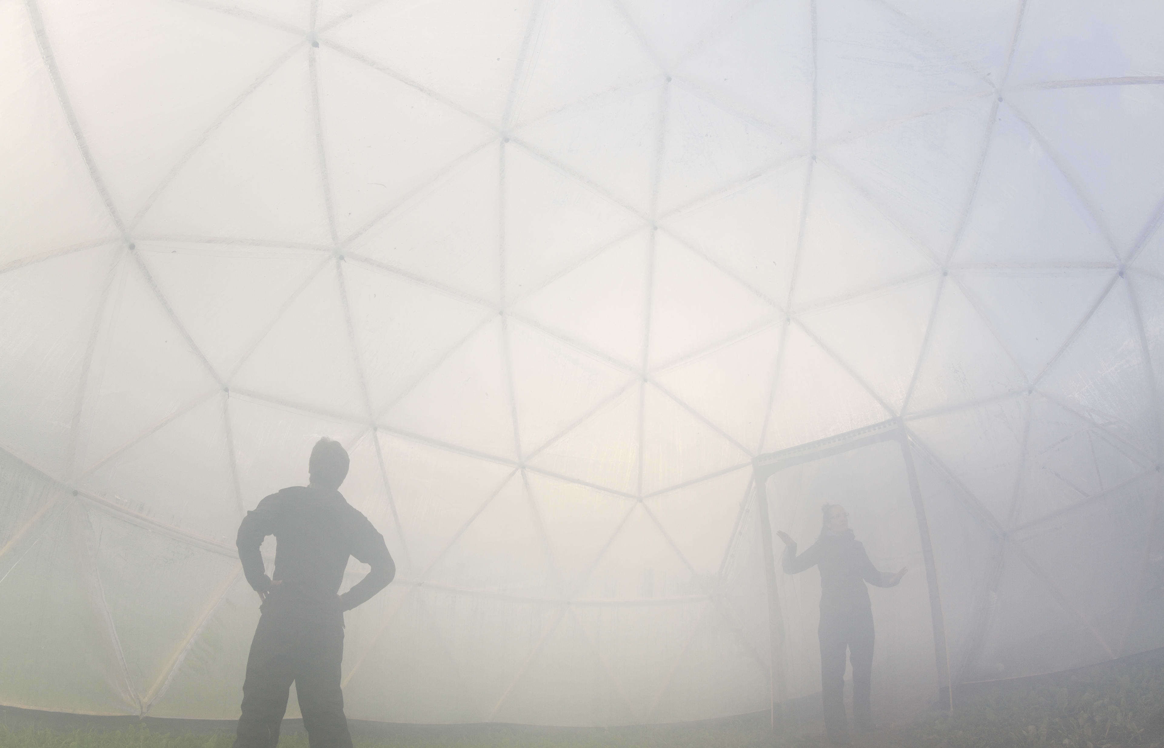 Visitors inside a smoke-filled dome, during a previous installation of artist Michael Pinksy's Pollution Pods. Photo credit: Thor Nielsen