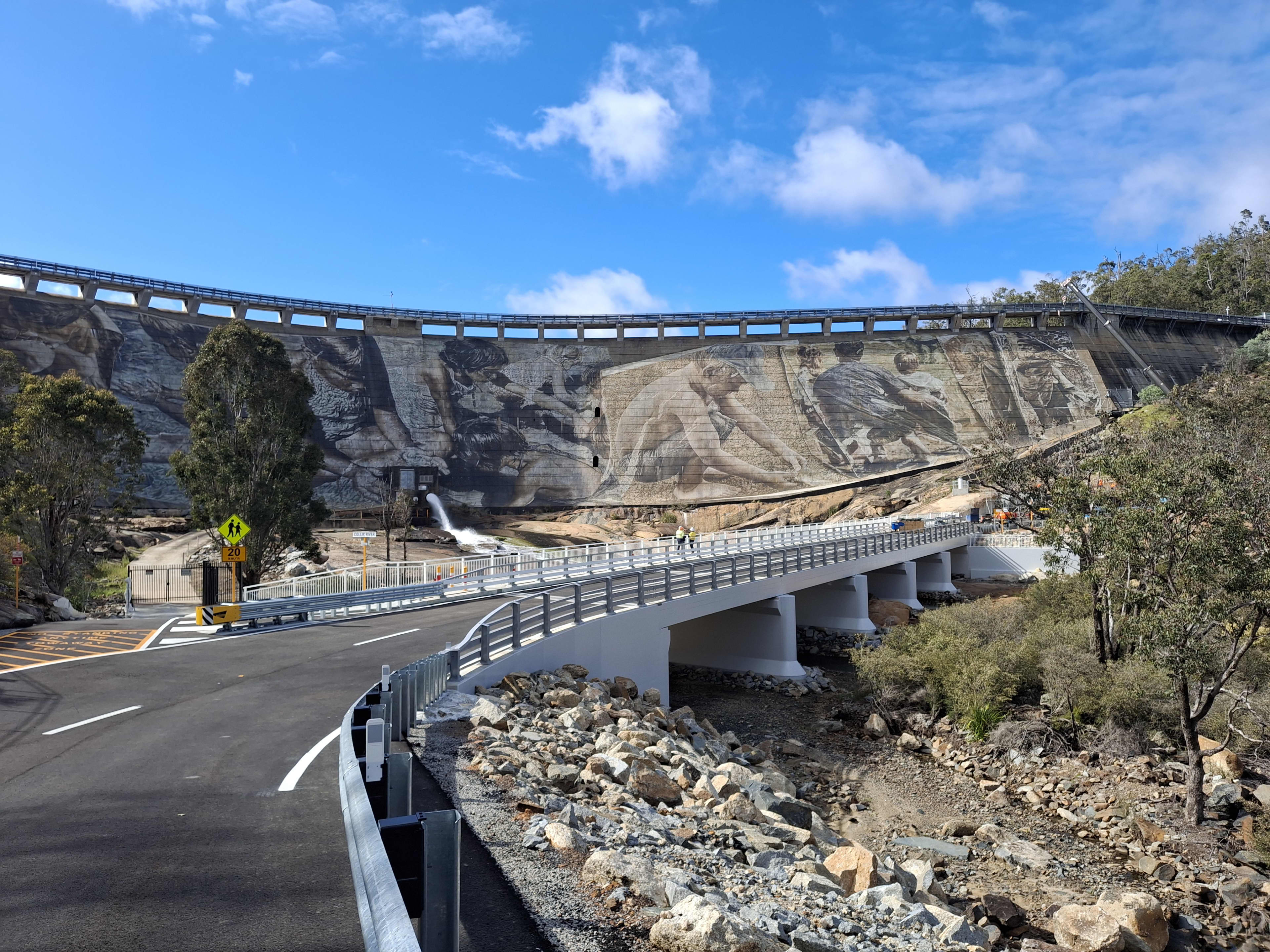 Ground level view of new bridge beneath dam wall.