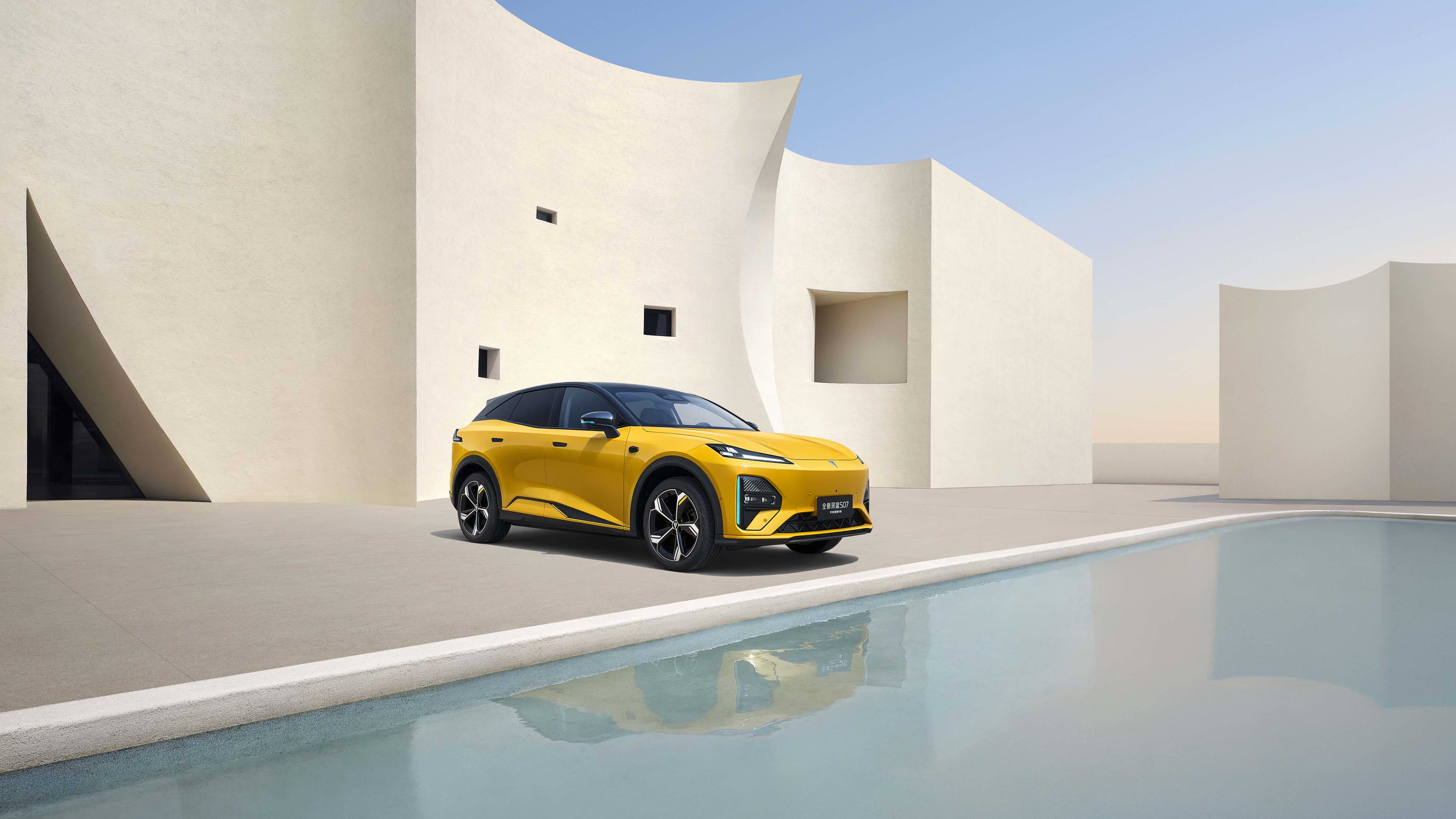 A yellow SUV parked next to a blue pool with light coloured curved walls in the background.