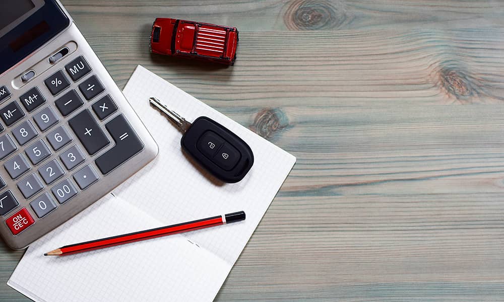 A calculator with car keys