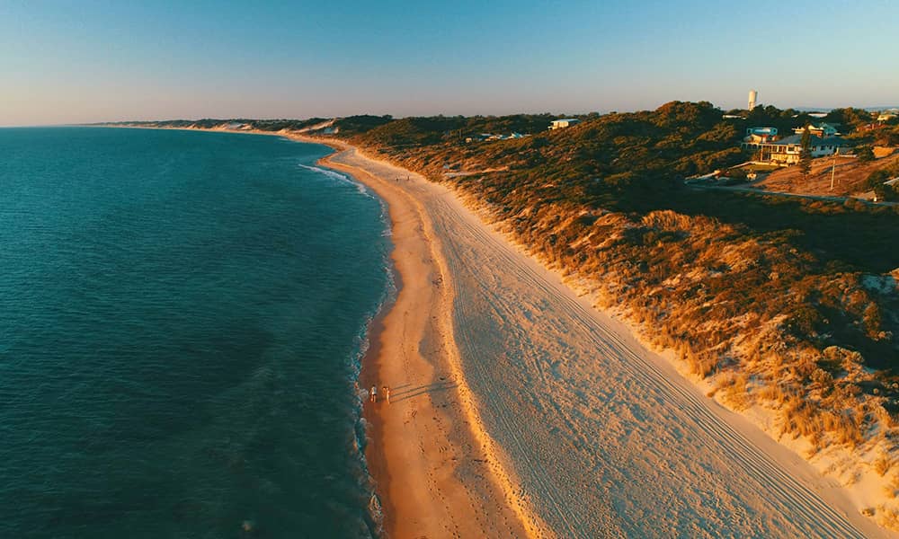 Long stretch of beach at sunset