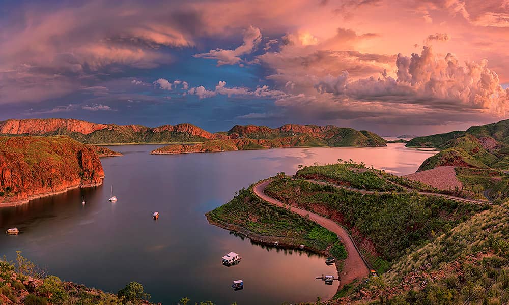 Aerial shot of Lake Argyle at sunset with boats in the water