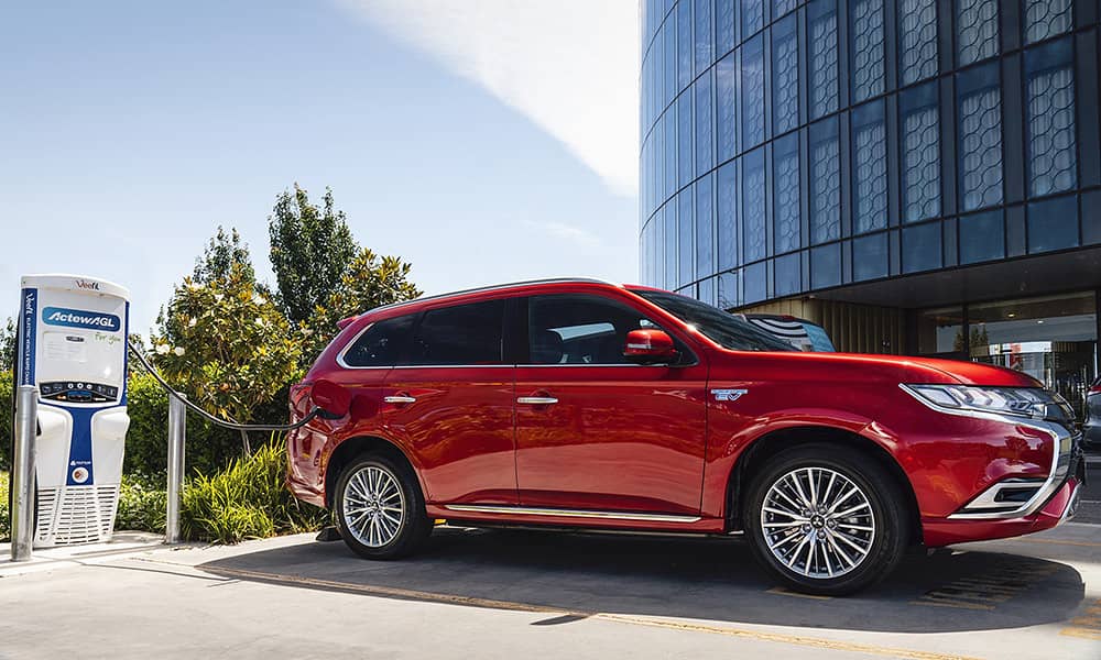 Red Mitsubishi Outlander hybrid car