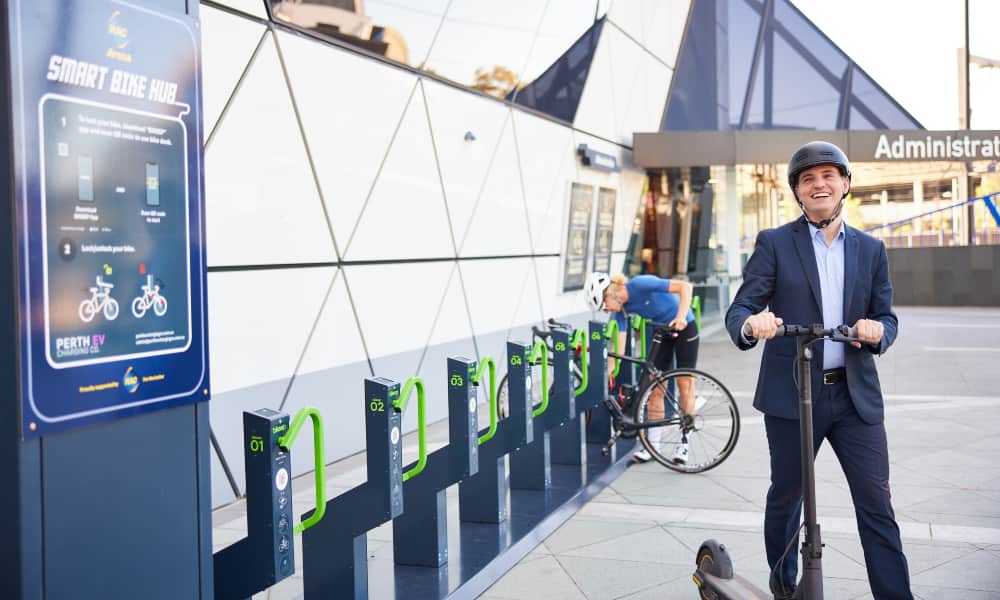 Two people using the Smart Bike Hub at RAC Arena.