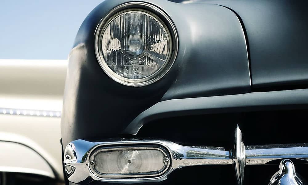 A front view of an old black vintage car