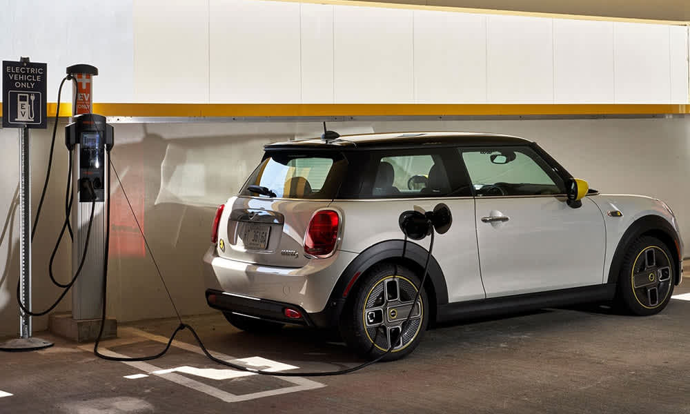 Mini Cooper EV hooked up to a charger