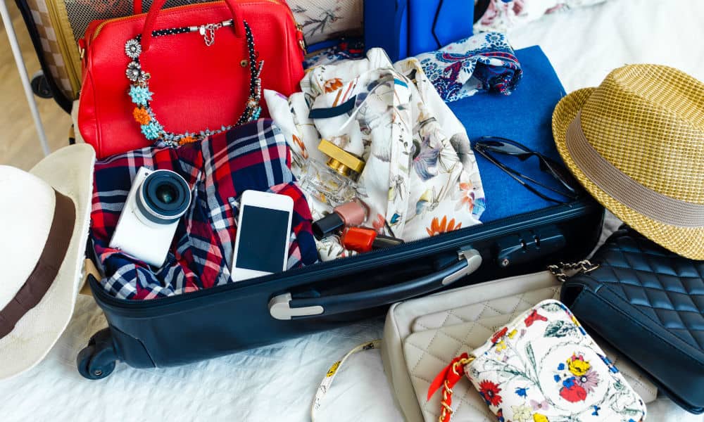 A packed suitcase on a bed