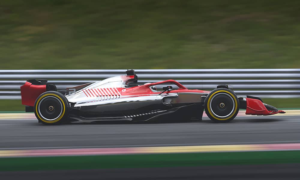 A Formula 1 car racing on a track with the background blurred to show speed