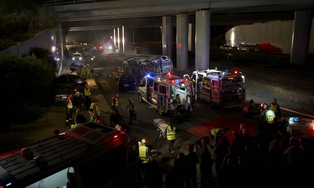 Emergency vehicles and staff attend the site of an accident