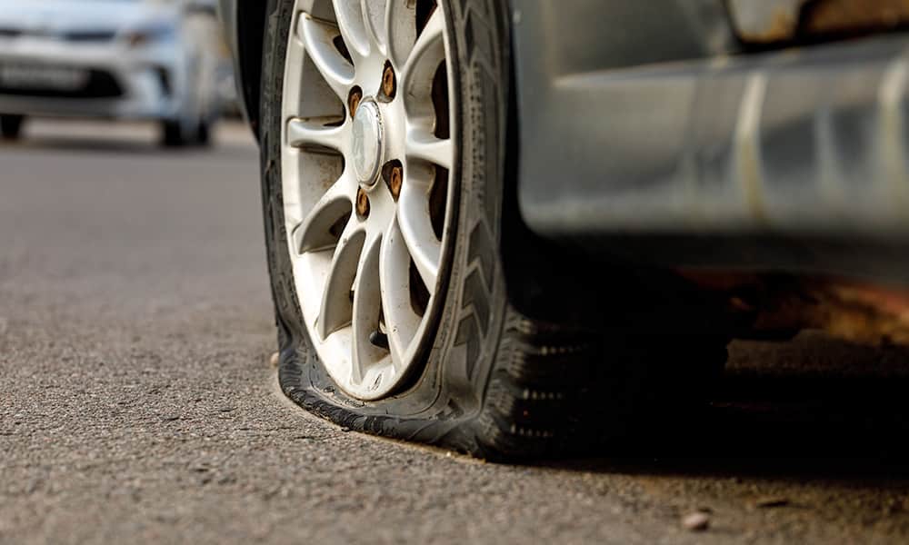Blown out tyre on road