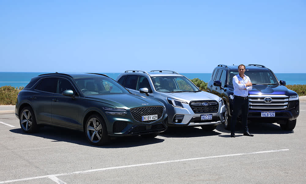 RAC's Alex Forest with a Genesis, Subaru and Toyota car