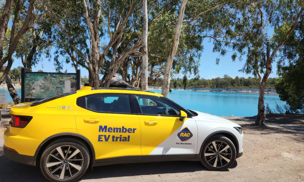 Yellow Polestar 2 electric car parked in front of Stockton Lake in Collie Western Australia