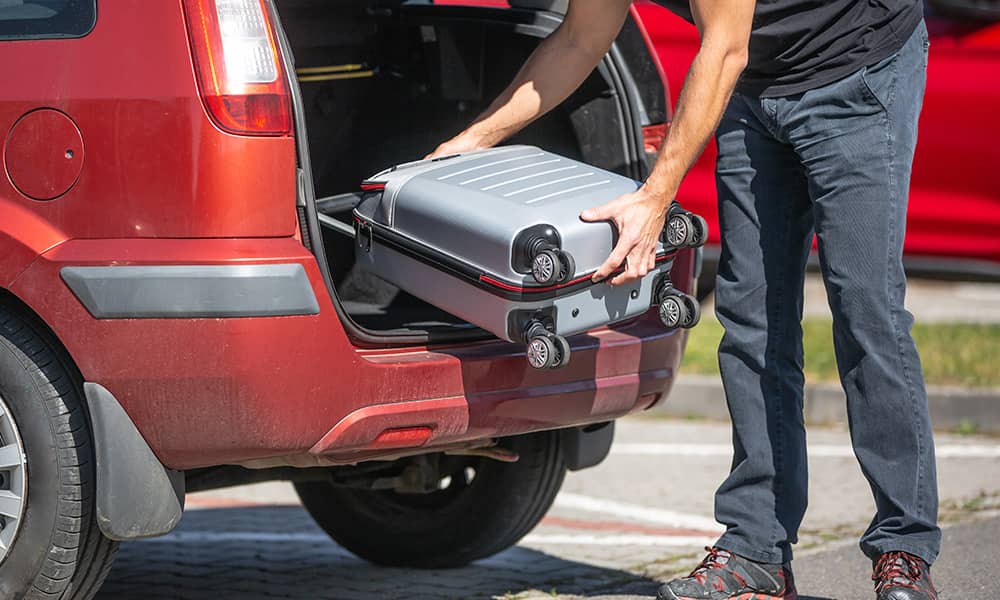 Image of man packing a car