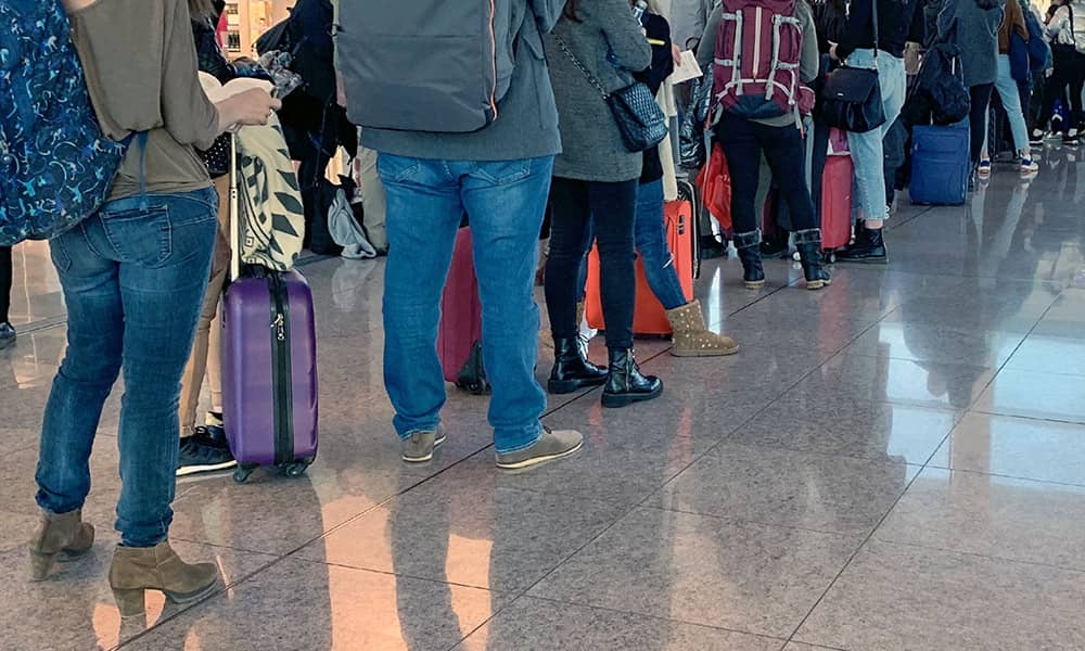 A queue of passengers in an airport